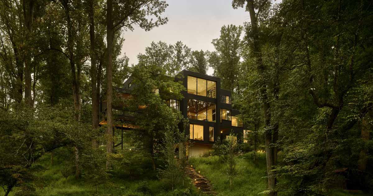 A Dark Exterior Helps To Hide This Modern Home In The Forest