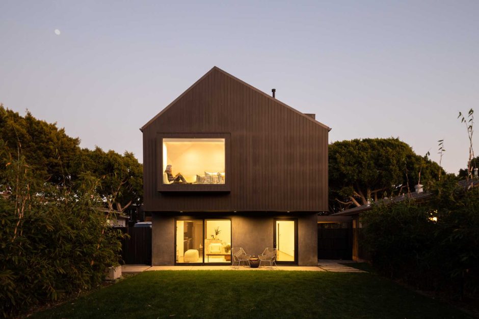 The Black Exterior Of This Barn-Inspired Home Is Contrasted With A ...