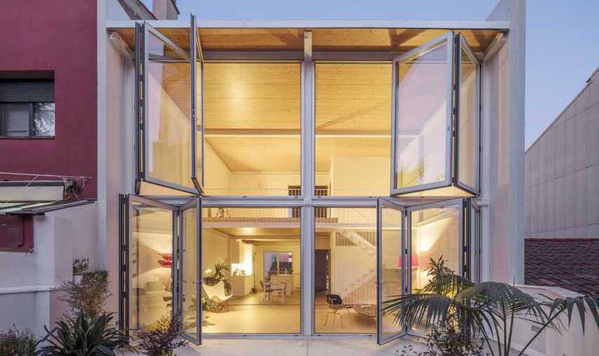 Large Folding Glass Walls Open This Home To A Courtyard