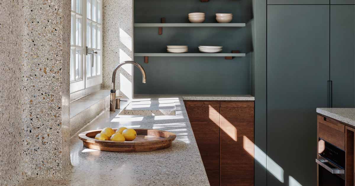 A Seamless Terrazzo Flows From The Wall To The Countertop In This Kitchen