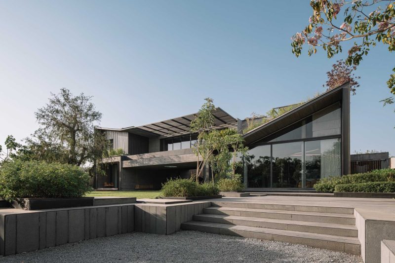 A Curving Bridge Leads To The Entertainment Areas Of This Modern Home