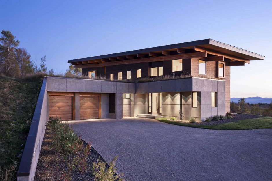 Exterior Lighting Shows Off The Post And Beam Structure Of This Home