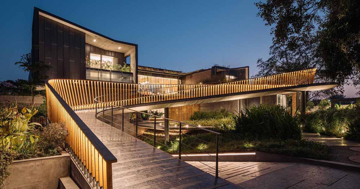 A Curving Bridge Leads To The Entertainment Areas Of This Modern Home