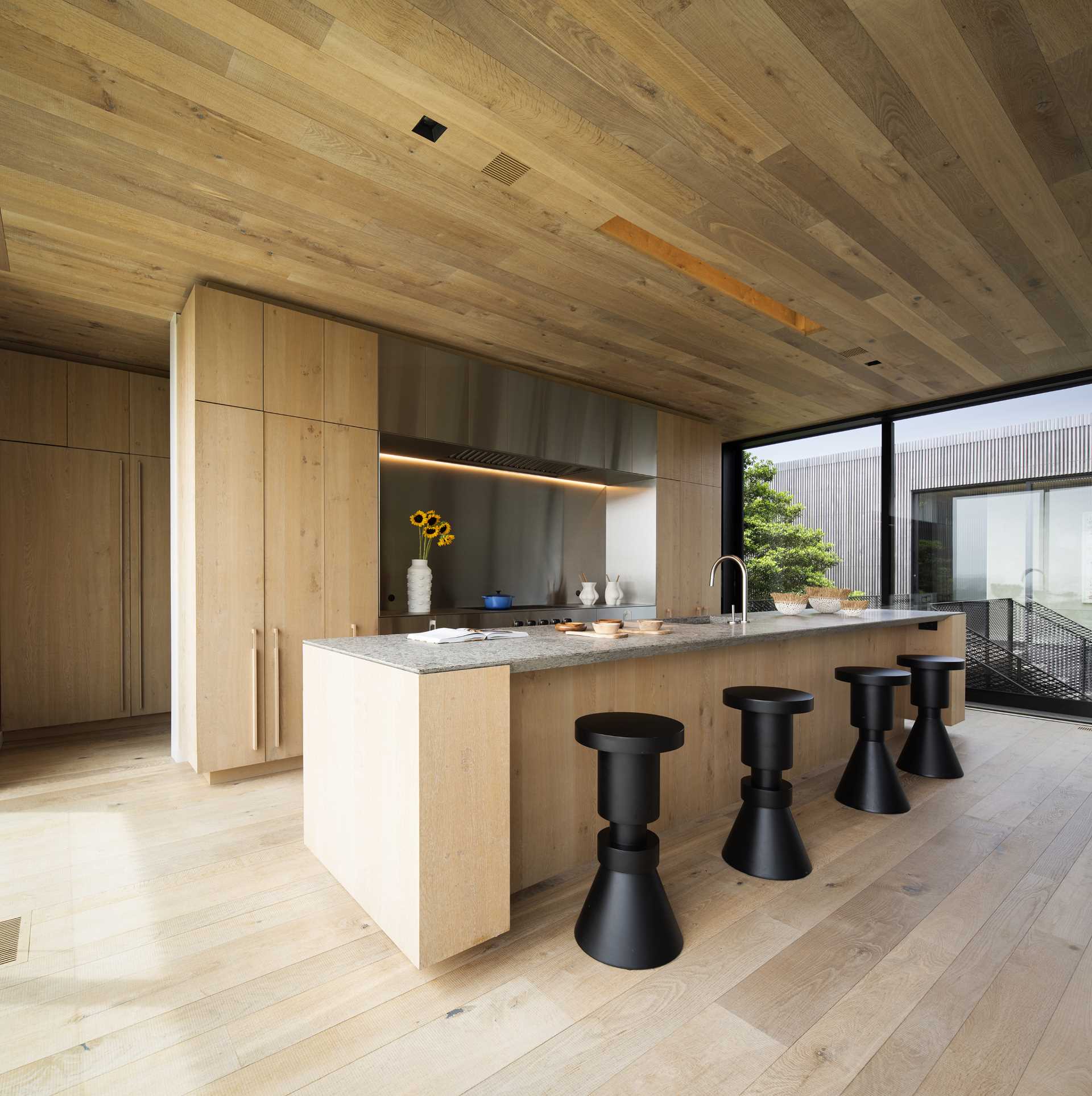 This wood kitchen, which has a large island, also includes a butler's pantry that's tucked away out of view.