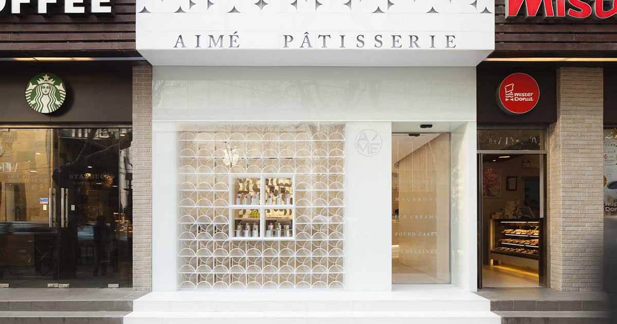 The Design Of This Modern White Patisserie Stands Out From Its Neighbors