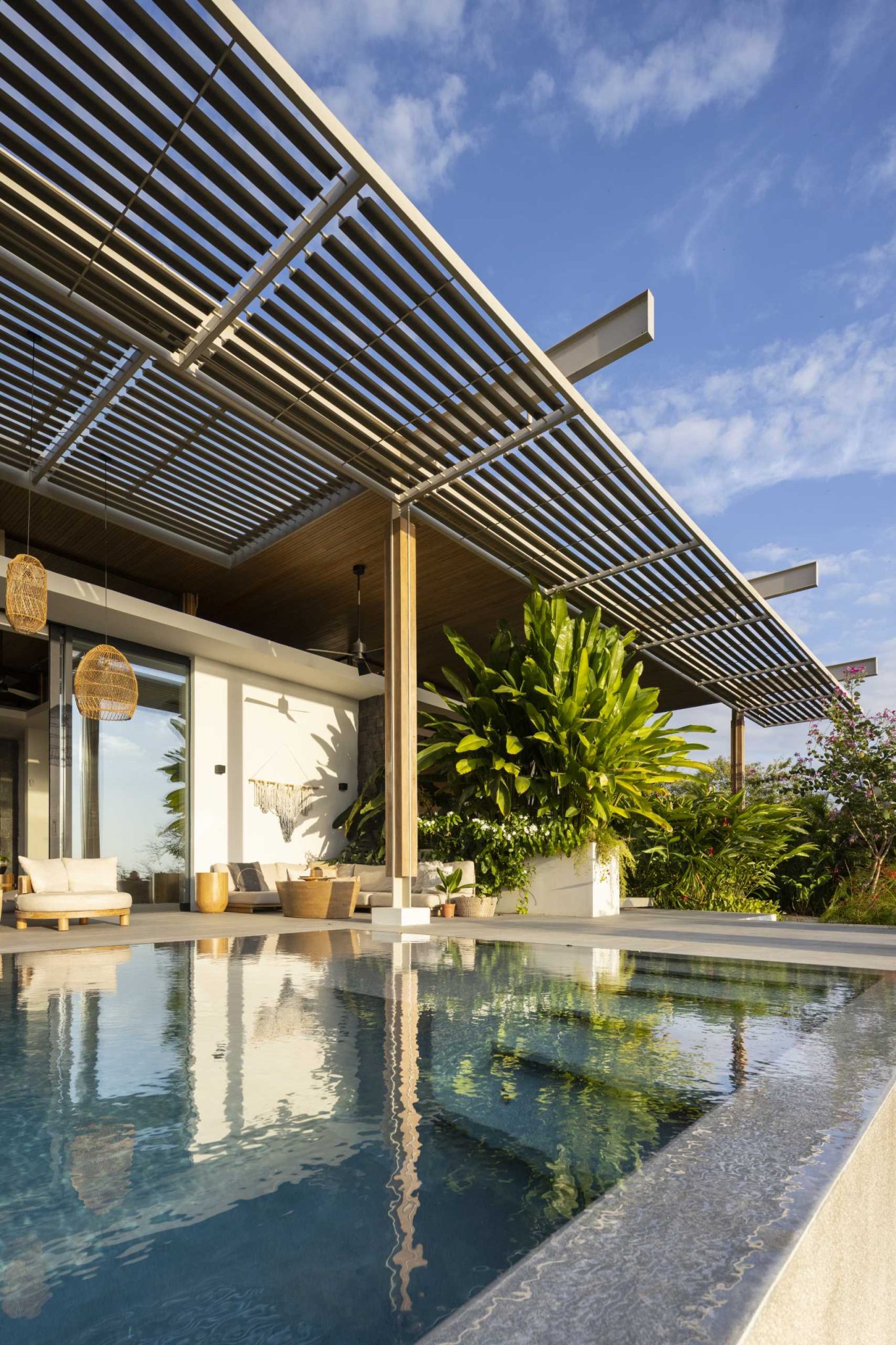 A Large Pergola Helps This Home Seamlessly Blend Indoor And Outdoor Spaces