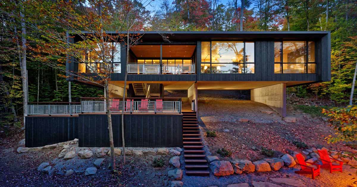 This Lakehouse Hovers Above The Natural Sloped Terrain