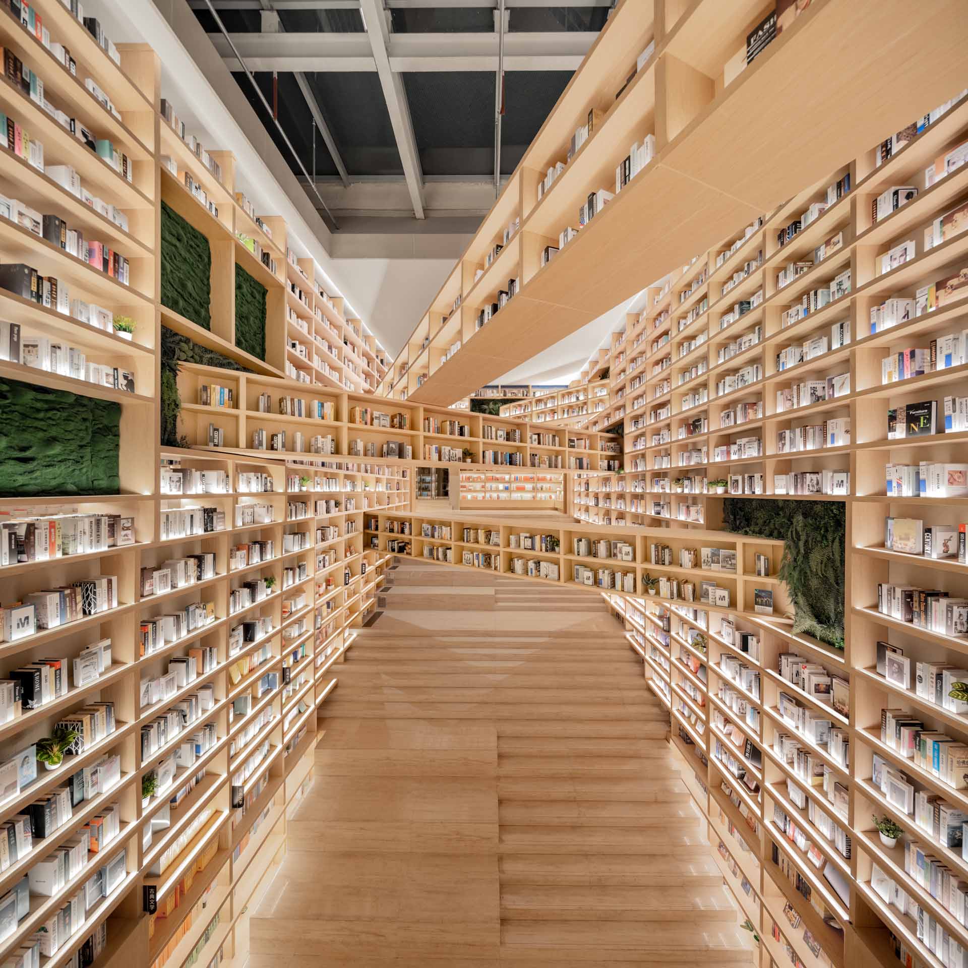 This bookshop has intersecting shelves in mid-air transcends, creating a space where diverse ideas, cultures, and perspectives meet and influence each other.