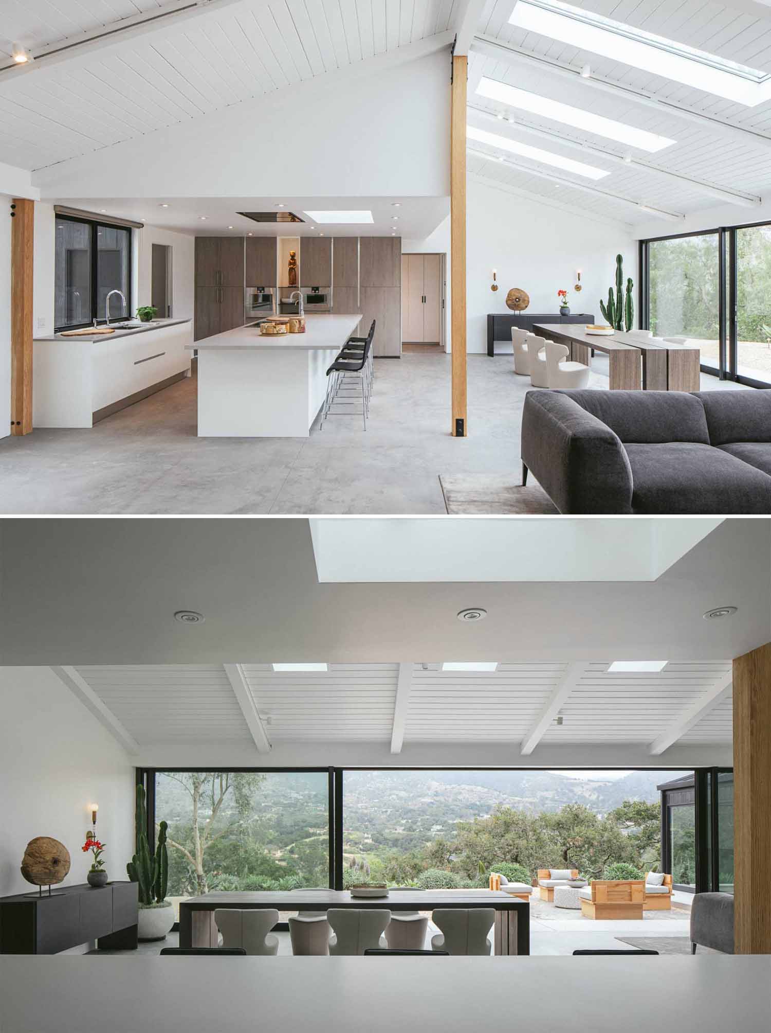 Interior surfaces of this renovated home, including carpets, vinyl flooring, and wood cladding, were changed to concrete and smooth gypsum siding, brightening the interior and modernizing the home.