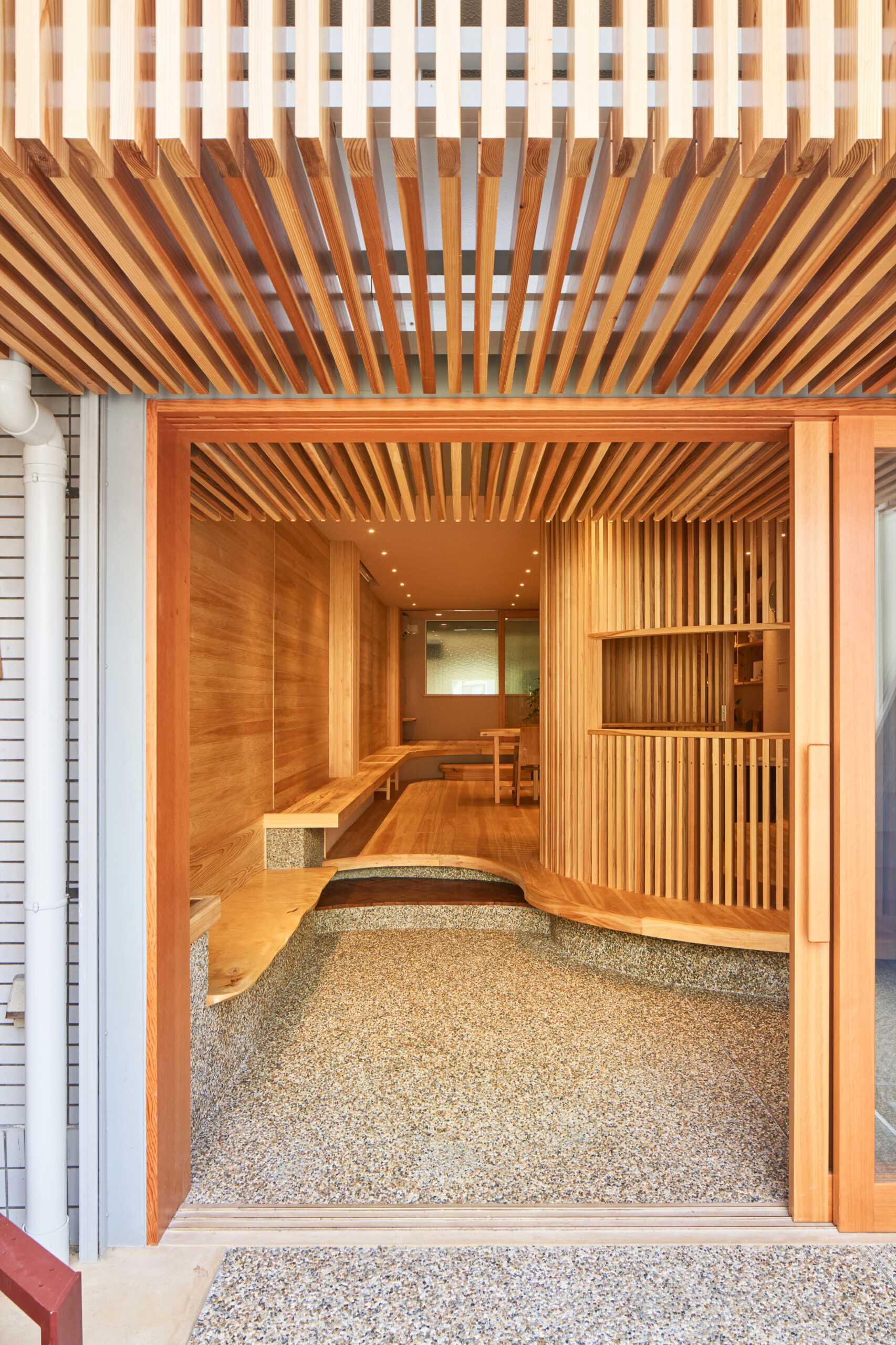 A small wood-lined office that was once a parking lot in Kyoto.