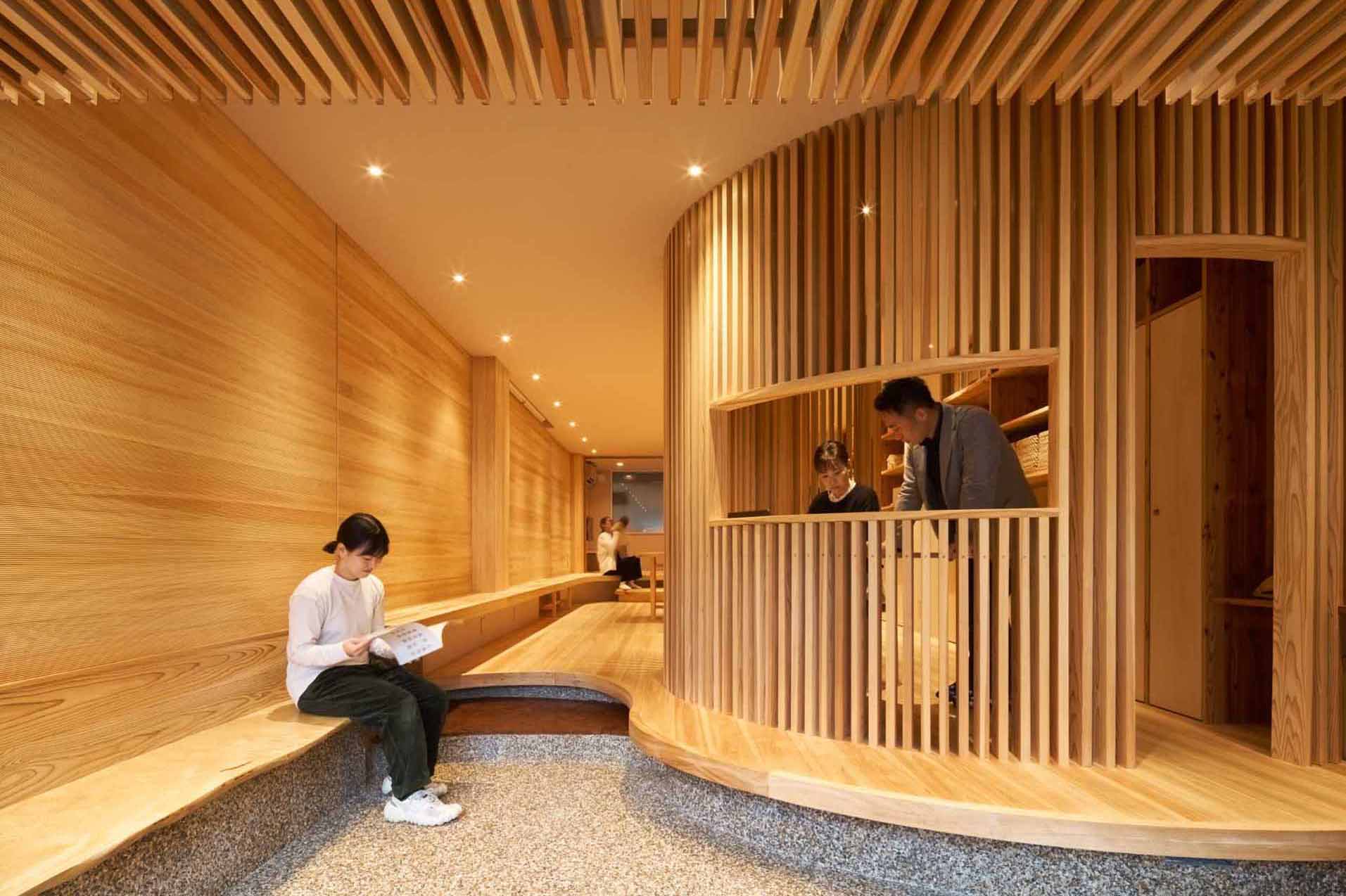Ujigawa Ohzono Architects has designed a small wood-lined office that was once a parking lot in Kyoto.