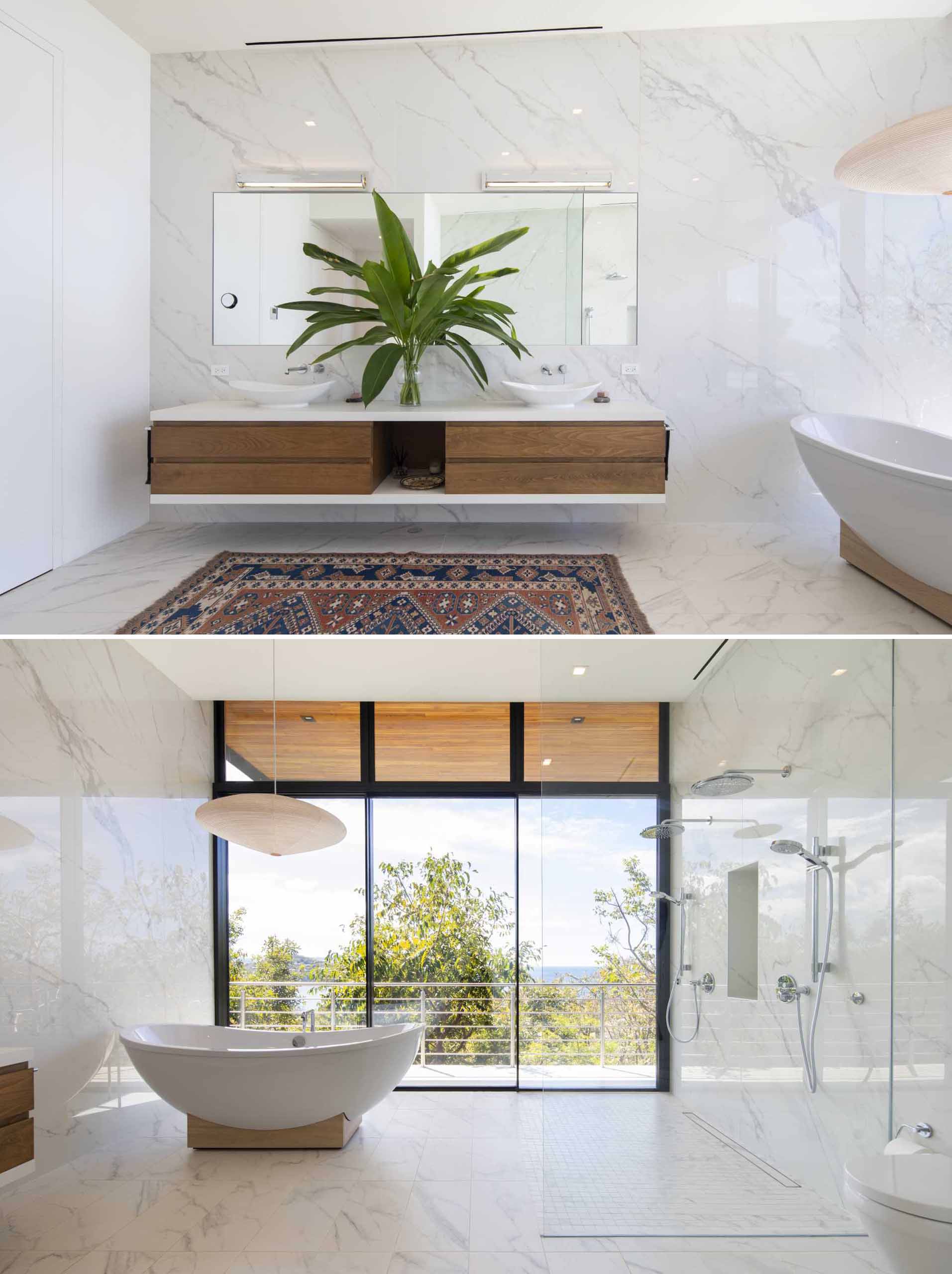 A contemporary bathroom design with a material color palette of wood, light colored tiles, white countertops, and glass.