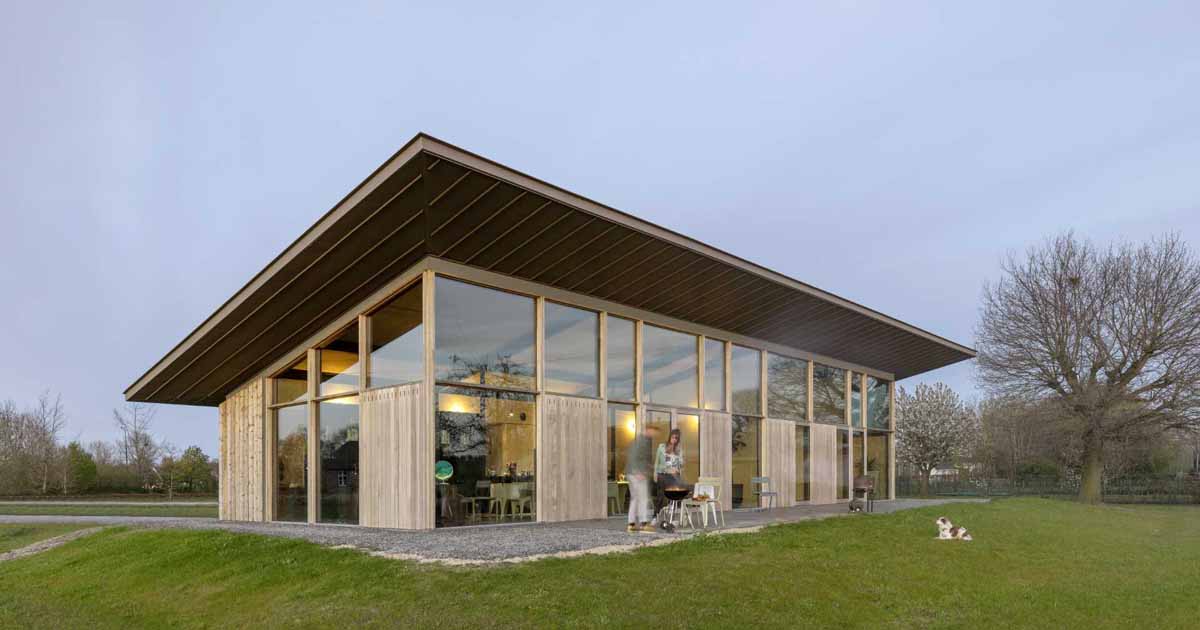 An Extended Sloped Roof Runs The Length Of This Modern Home