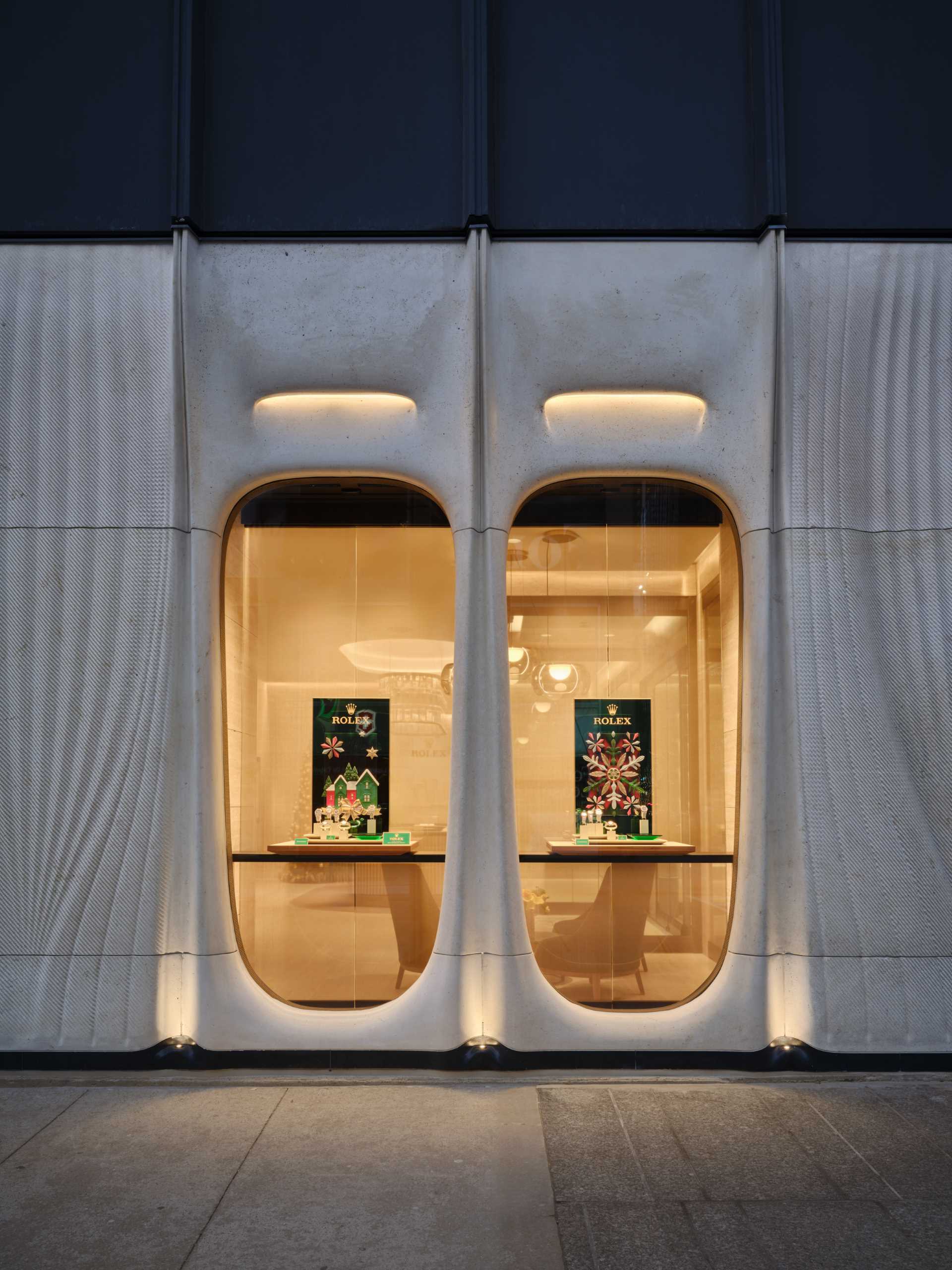 A modern retail boutique with a sculptural limestone facade.