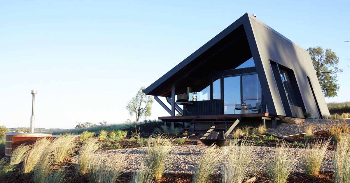 A Metal Roof Wraps Around This Off-Grid Cabin To Protect It From The Elements