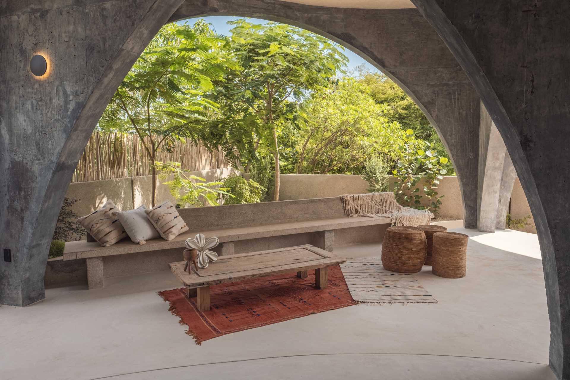 Built-in elements are featured throughout the home, like this day bed and concrete bench.