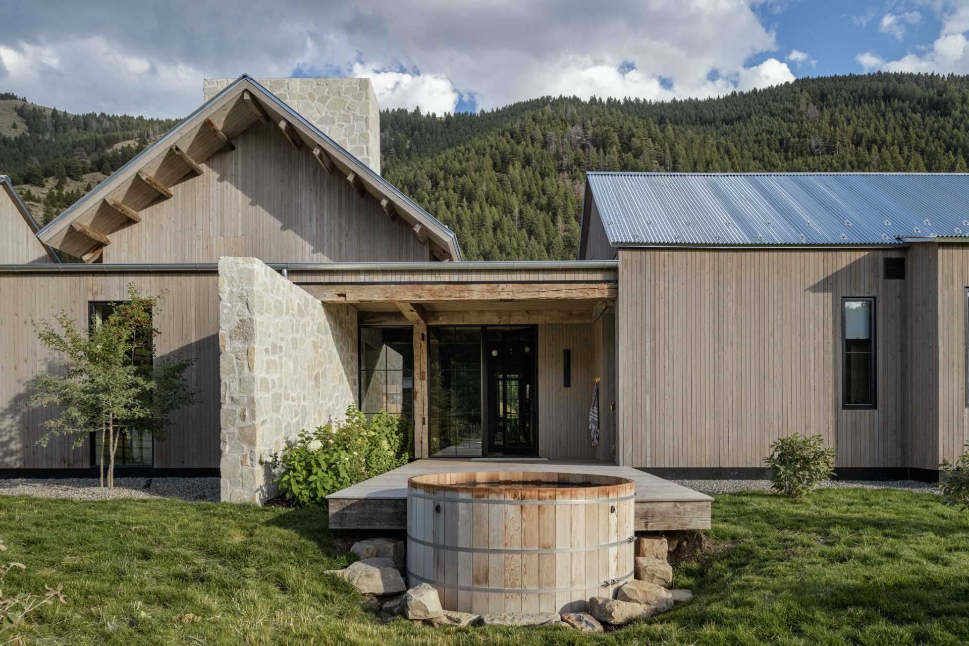 An outdoor hot tub off the side of the home creates an ideal spot to relax.