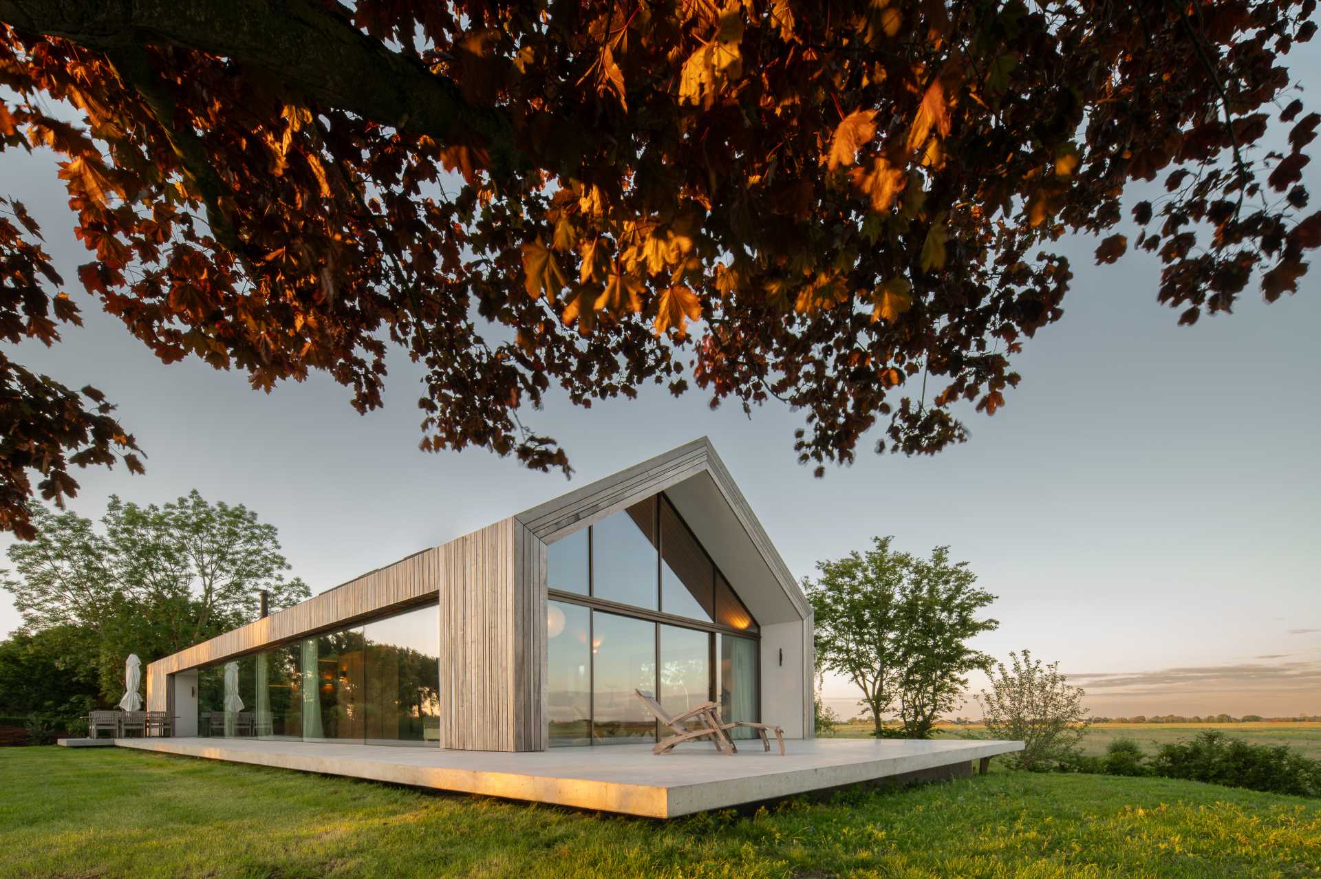 A Contemporary Gable Roof Runs The Length Of This Home