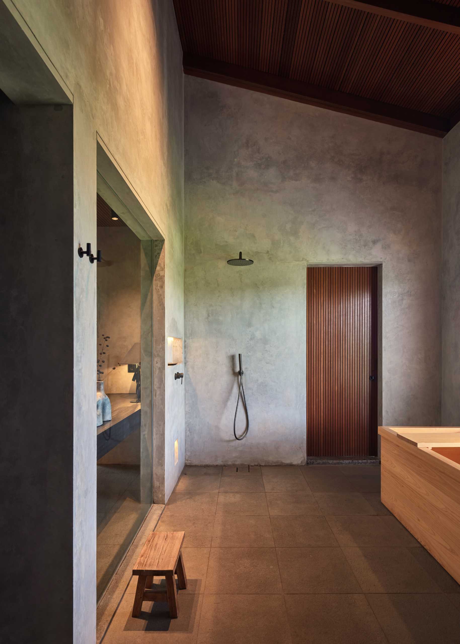 Japanese-inspired bathroom with deep a wood soaking tub.