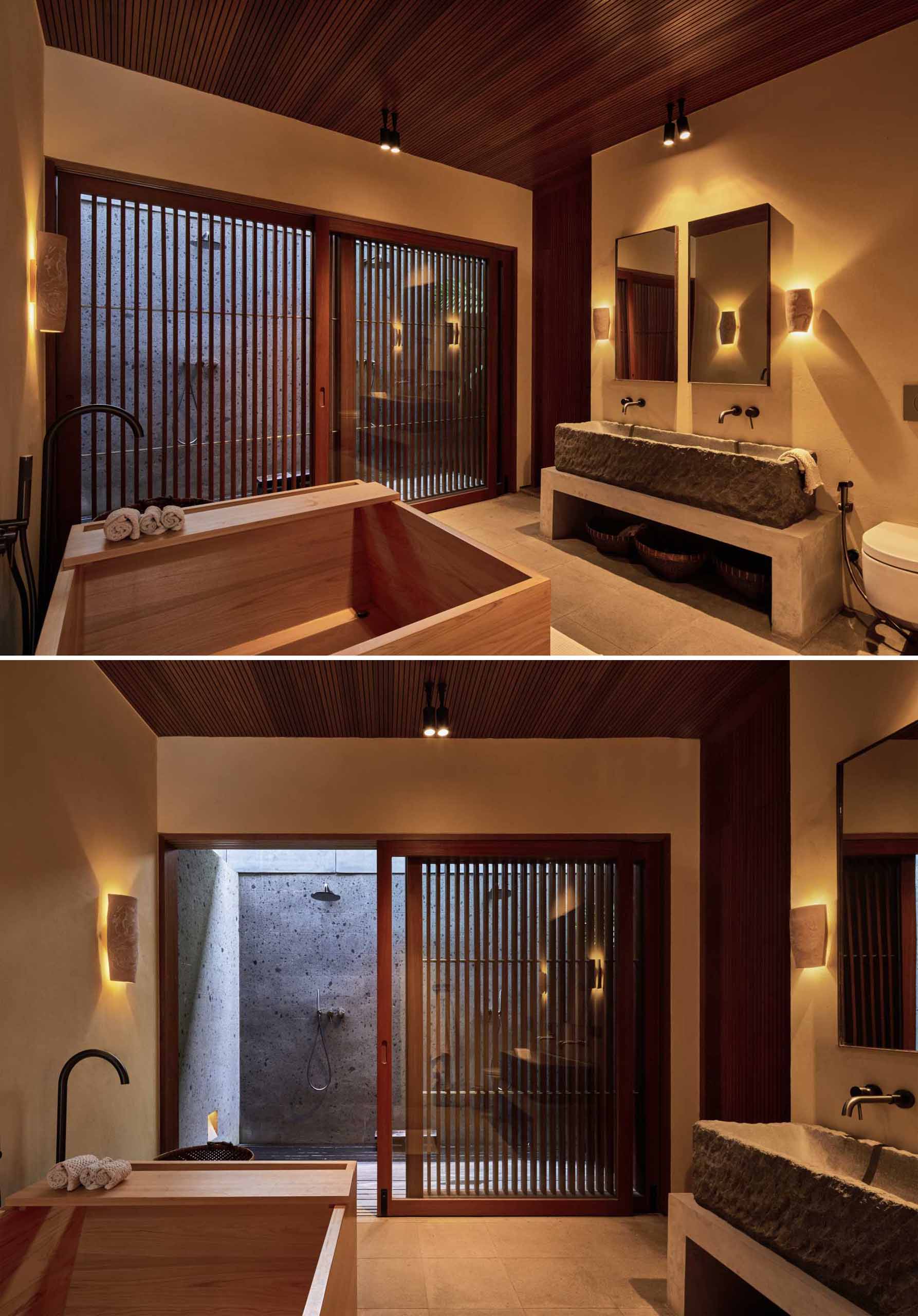 Japanese-inspired bathroom with deep wood soaking tub and outdoor shower.