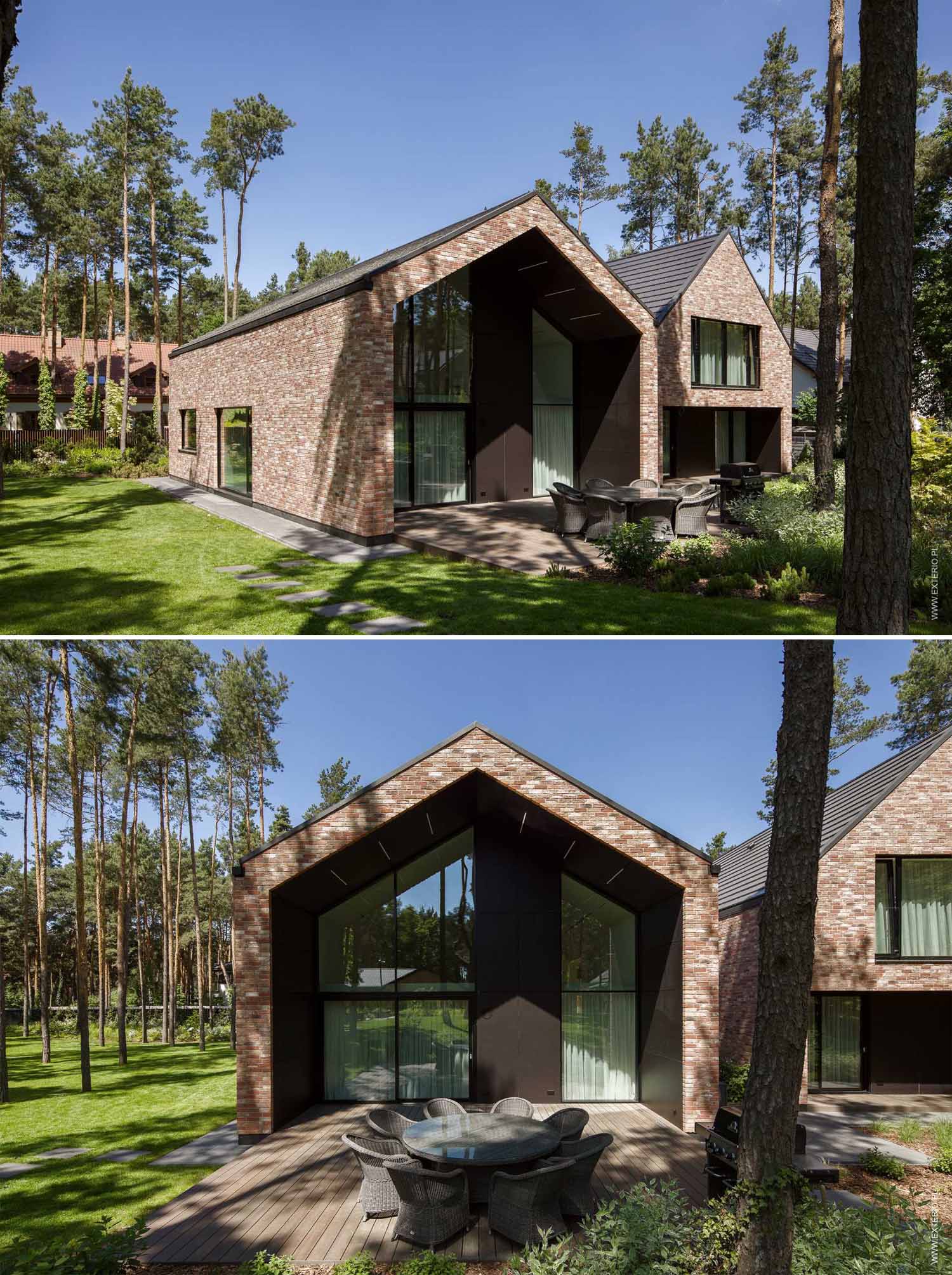 A modern home with a handmade rustic brick exterior, and dark ceramic roof tiles.