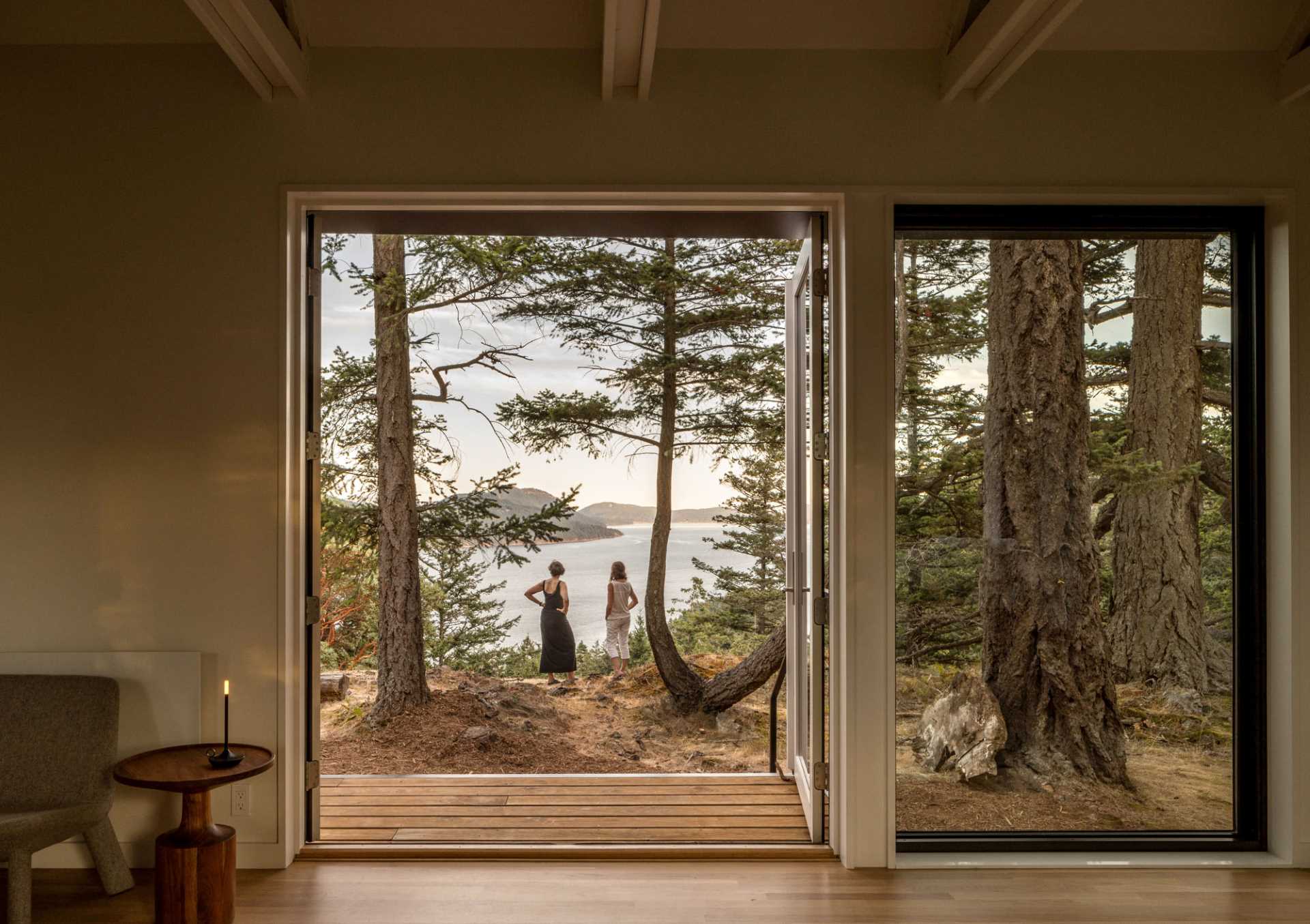 A modern island house has doors that open to a deck.