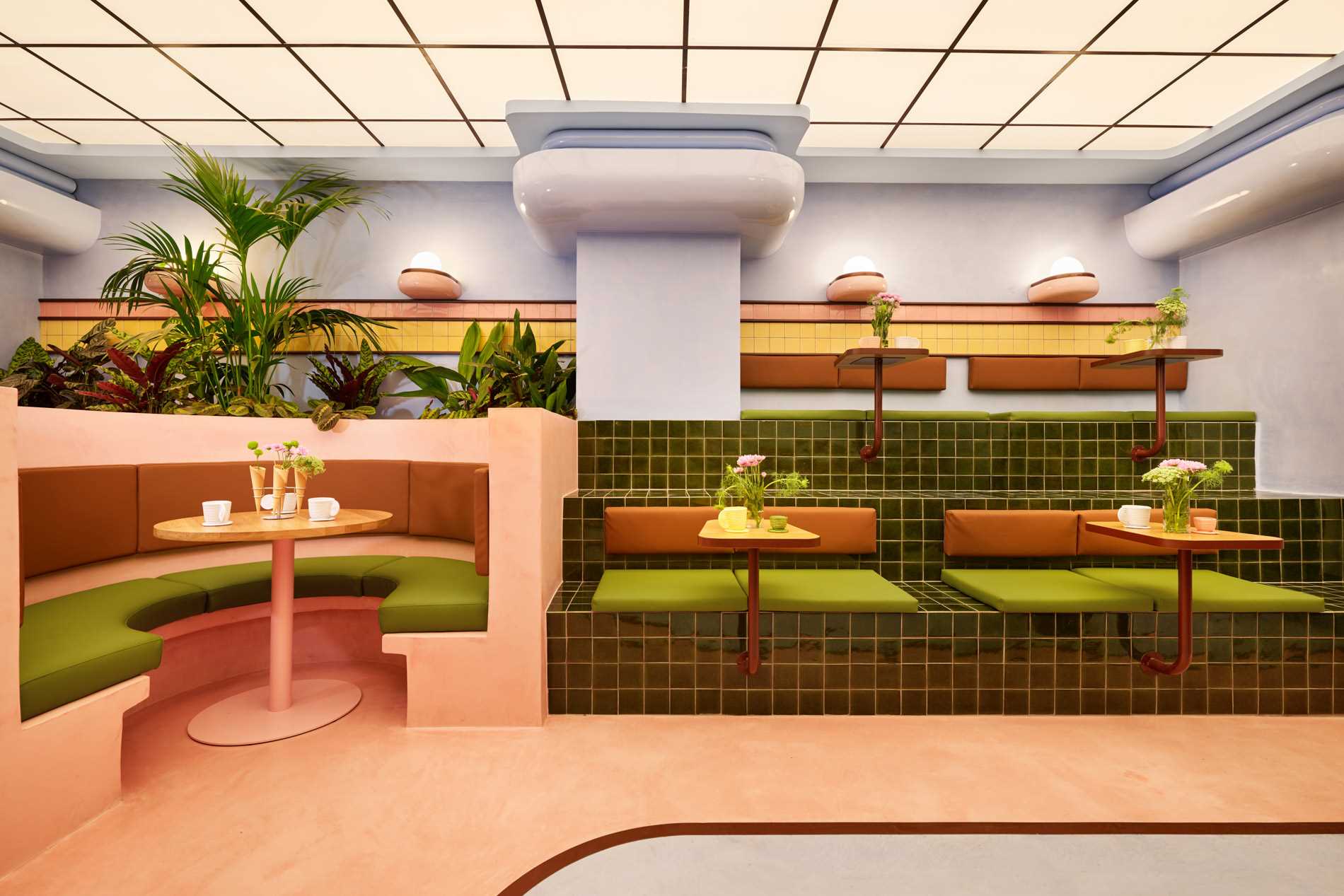 The interior design of Amiko Gelato  blends futuristic design with art deco elements, like curves, glazed tiles, and pastel colors.