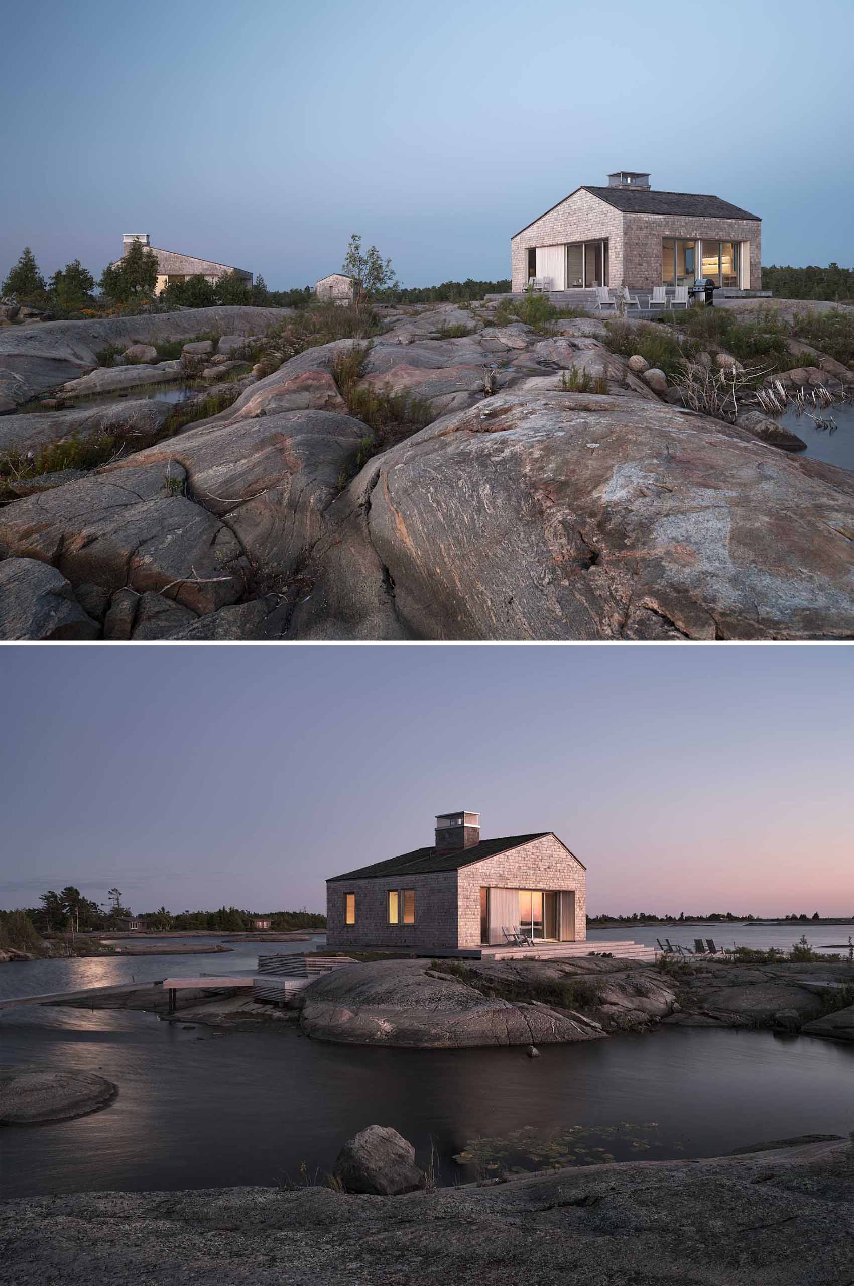 A contemporary cottage that comprises a cluster of buildings, each clad in shingles.