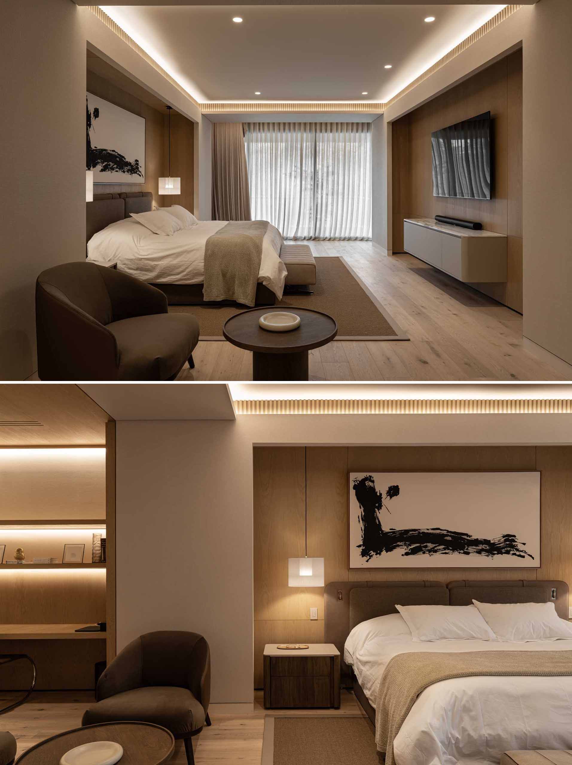 A modern primary bedroom with wood elements and hidden lighting.