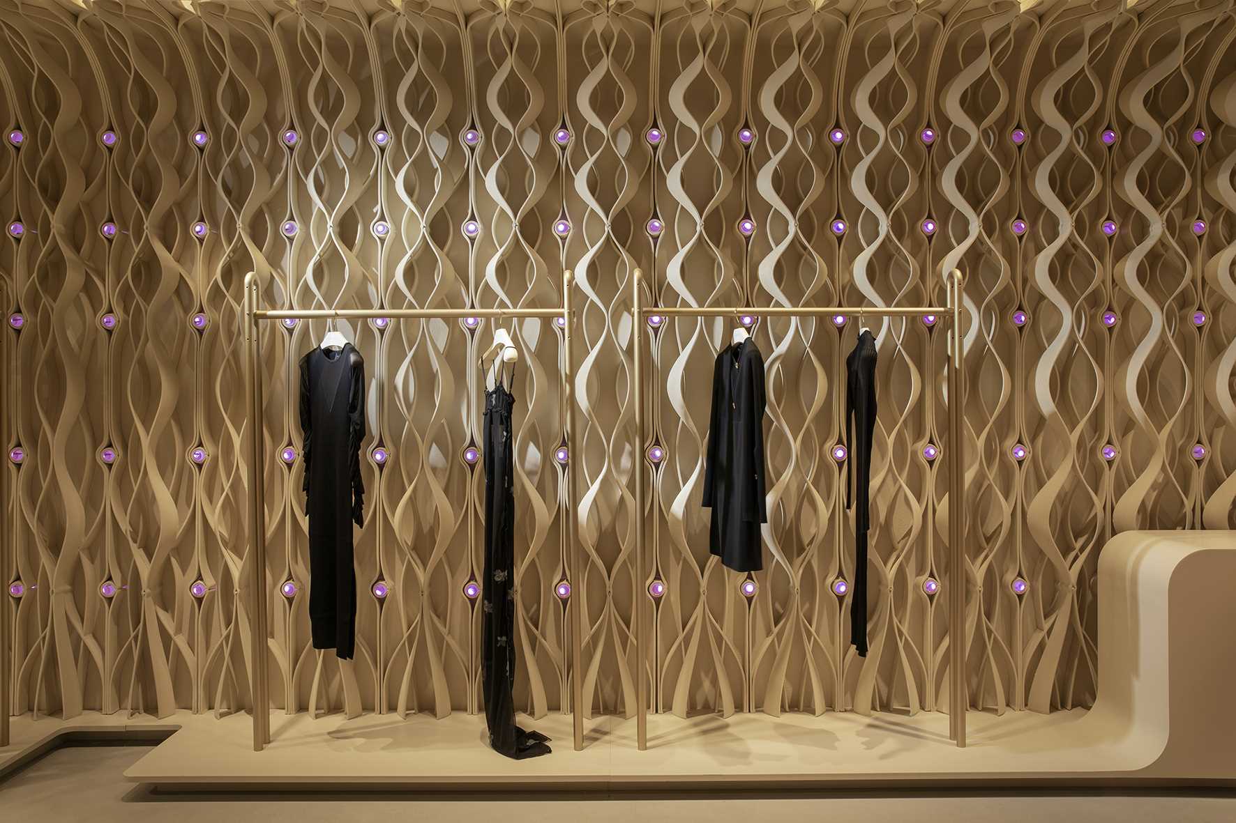 A modern retail store with 3D-printed design elements that line the walls.