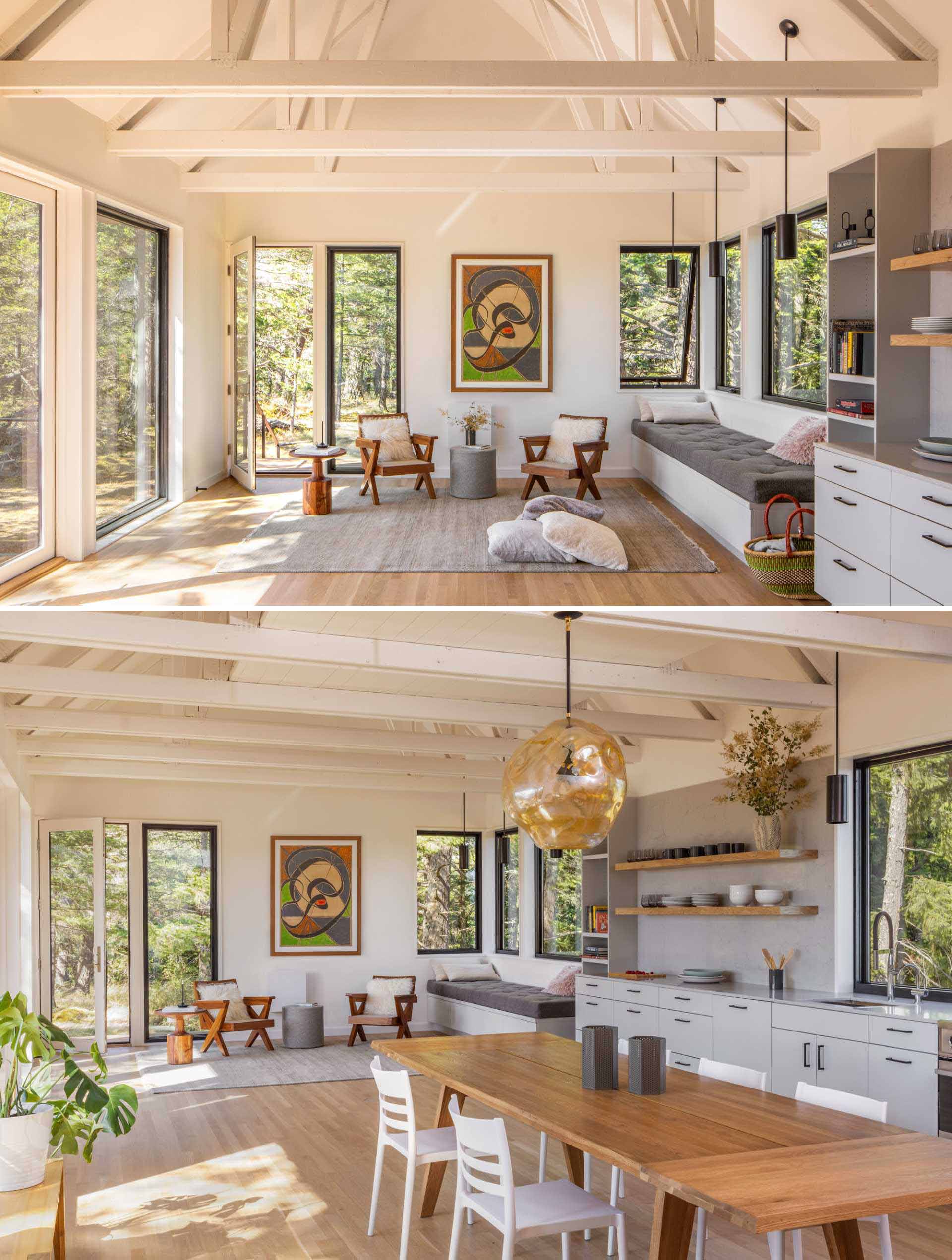 In this modern living room, a built-in bench under the windows increases the seating options.