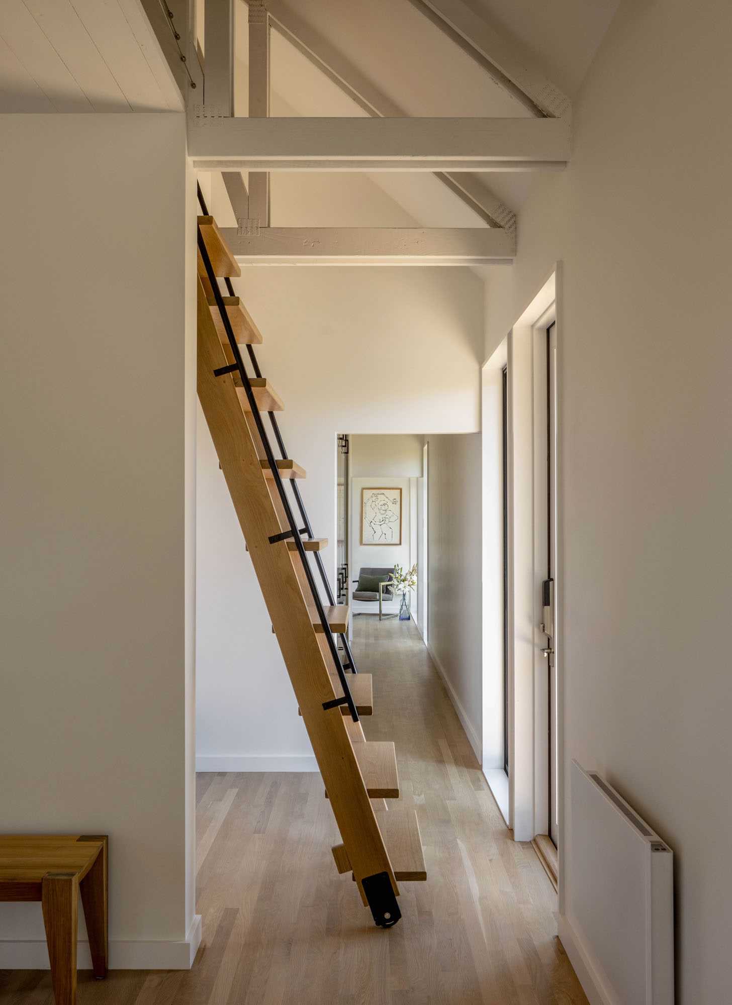 Stairs tucked away in the hallway can be pulled out to provide access to the loft.