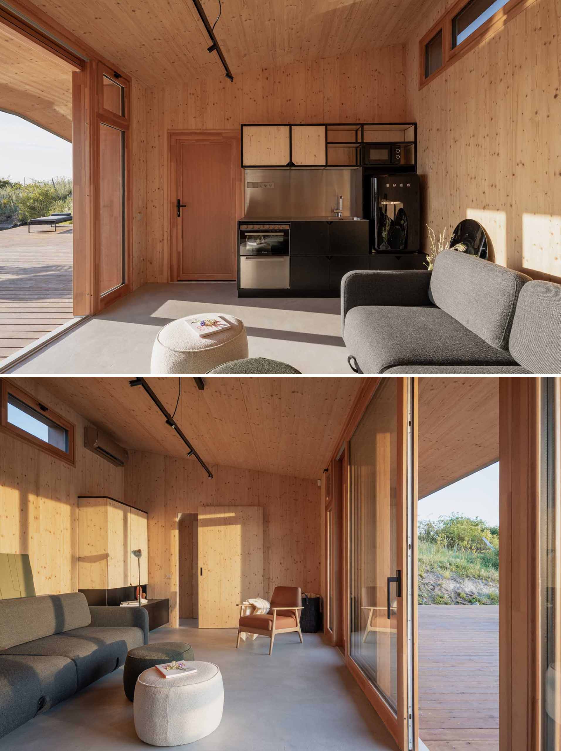 Inside this small ،use, the living room and small kitchen share the wood-lined ،e with an angled ceiling. 