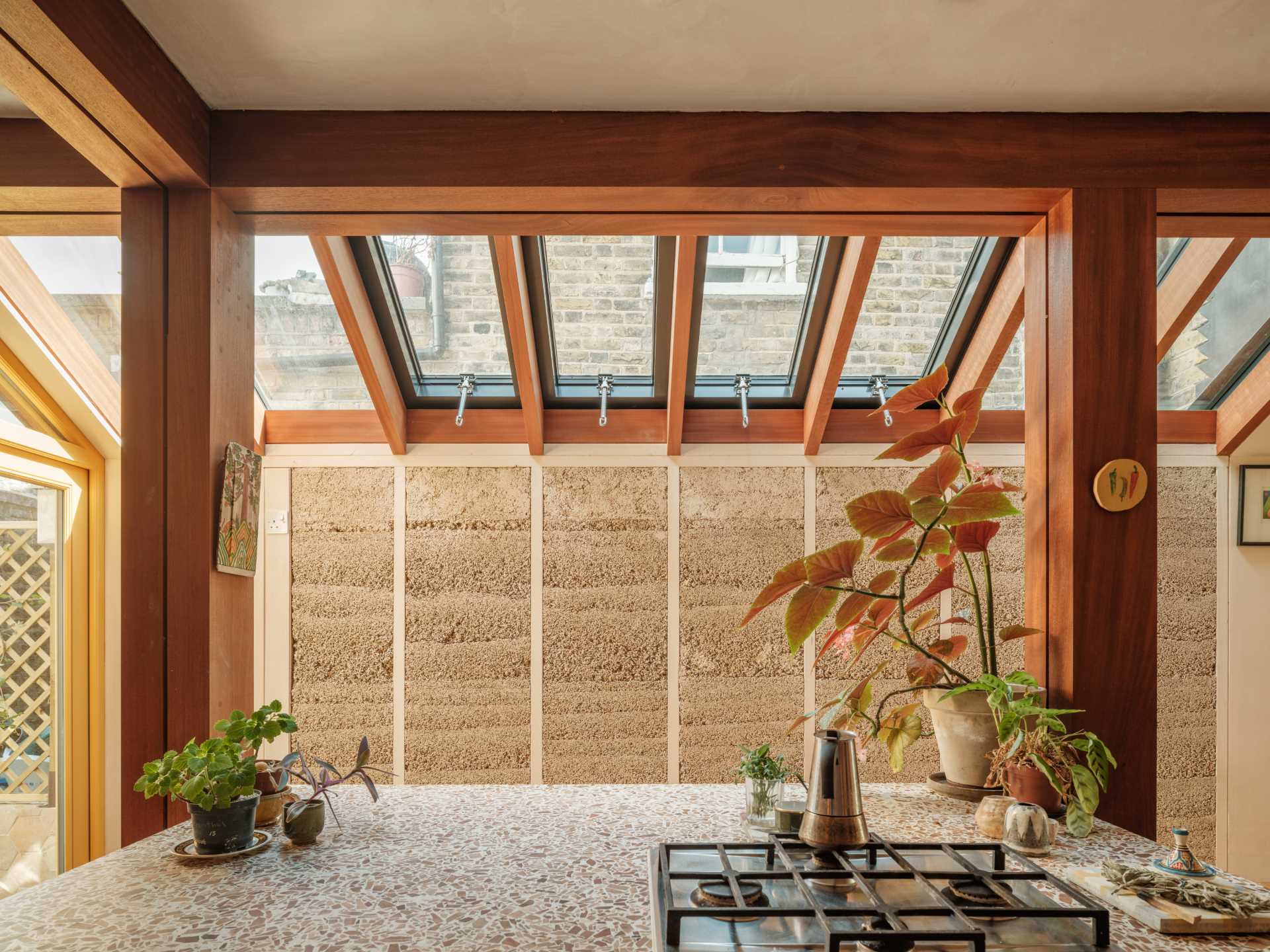 A new home extension displays unique hempcrete walls and hardwood framing.