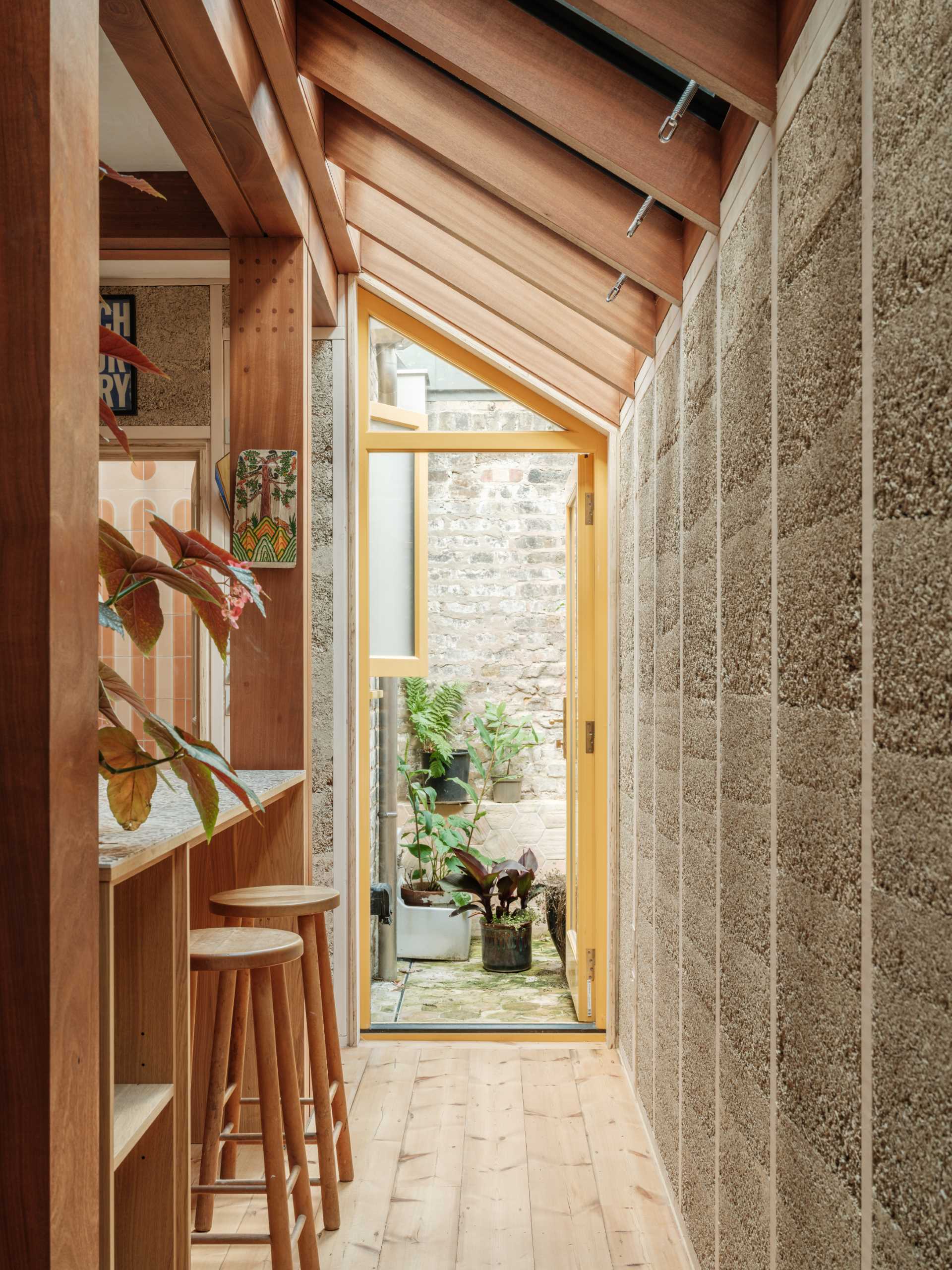 A new home extension displays unique hempcrete walls and hardwood framing.