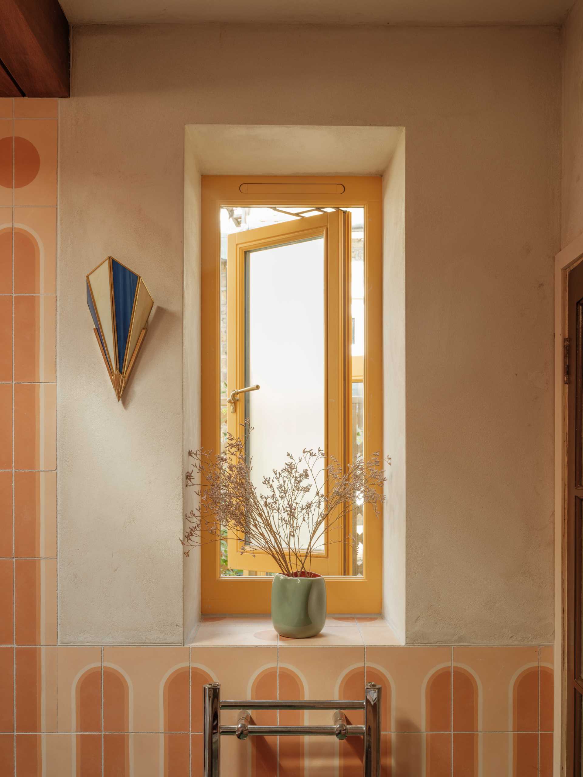 A contemporary bathroom with a window.