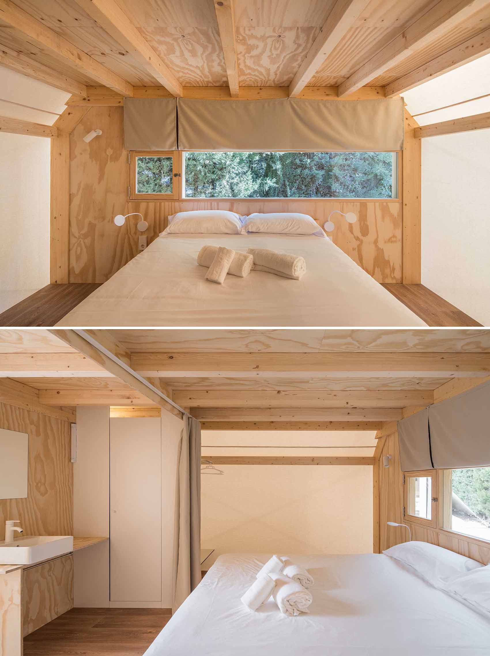 A modern glamping tent with a living room, kitchen, main bedroom, bathroom, and second lofted bedroom.