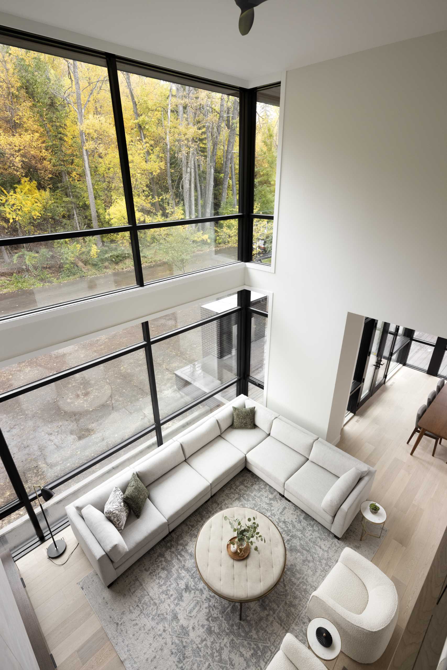 Stairs lead from the main level up to the lofted area, which provides a top-down view of the living room below.