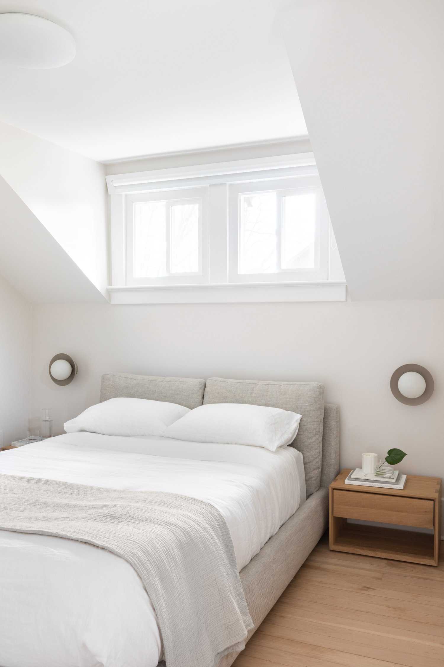 A modern coastal-inspired bedroom with a neutral and contemporary color palette.