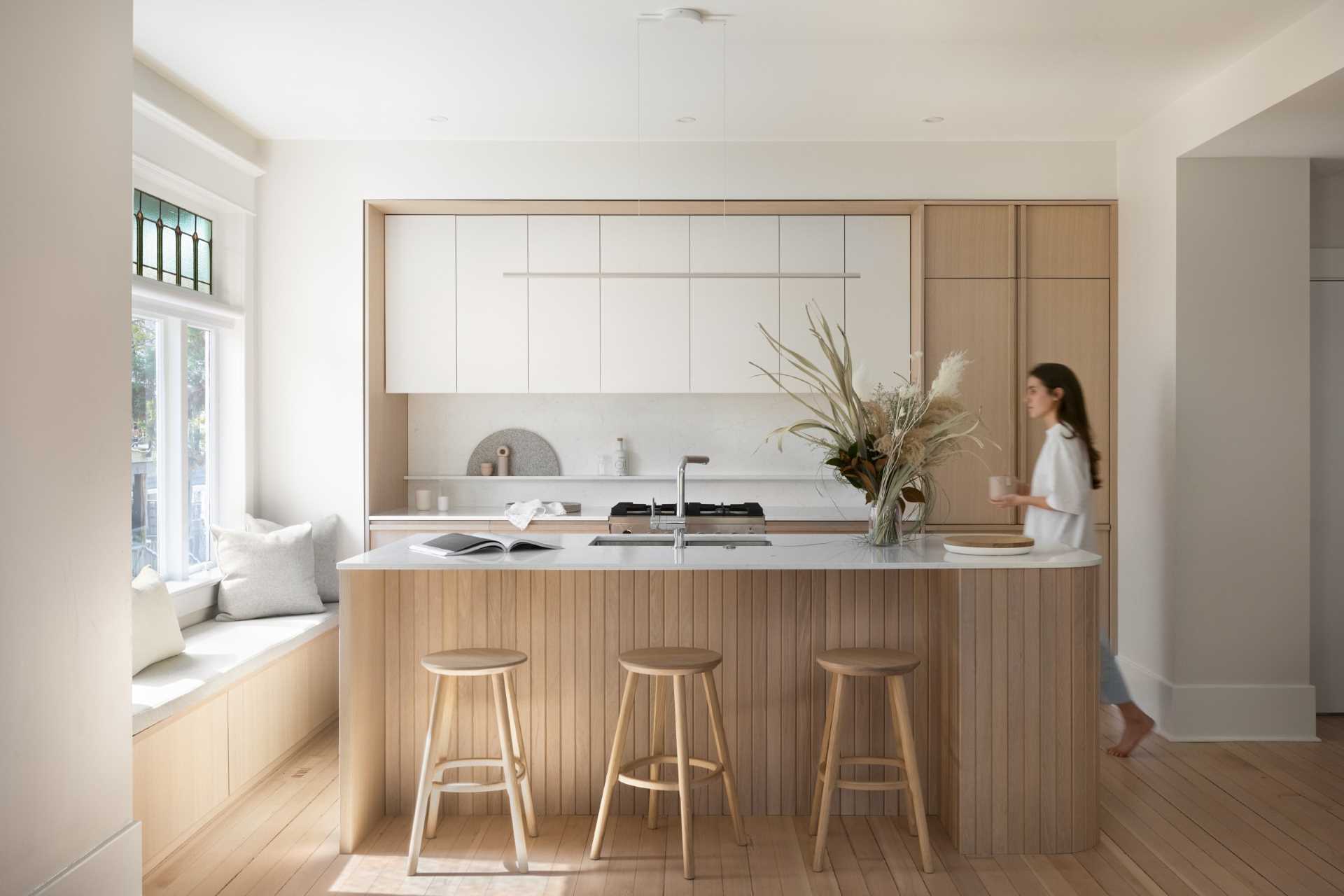 A modern coastal-inspired kitchen with a neutral and contemporary color palette.