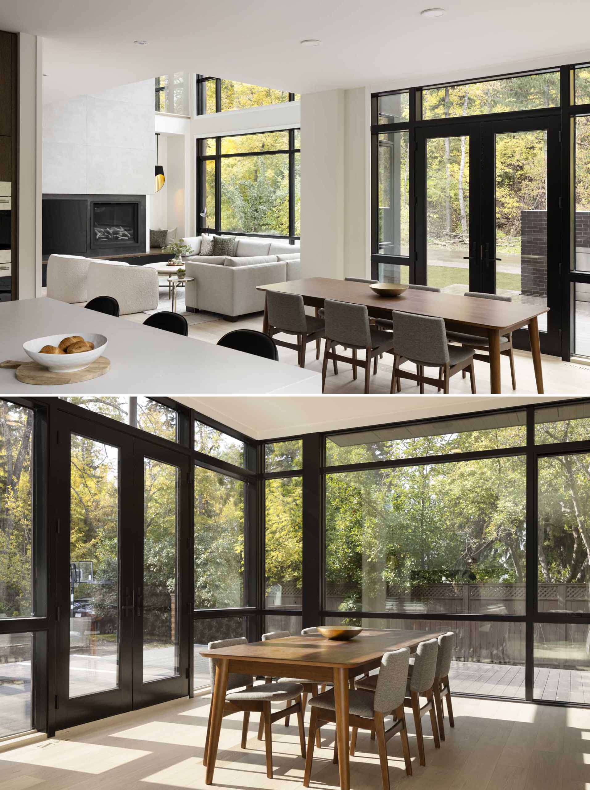 This open-plan dining area has windows on two sides, with black-framed doors that open to an outdoor living room.