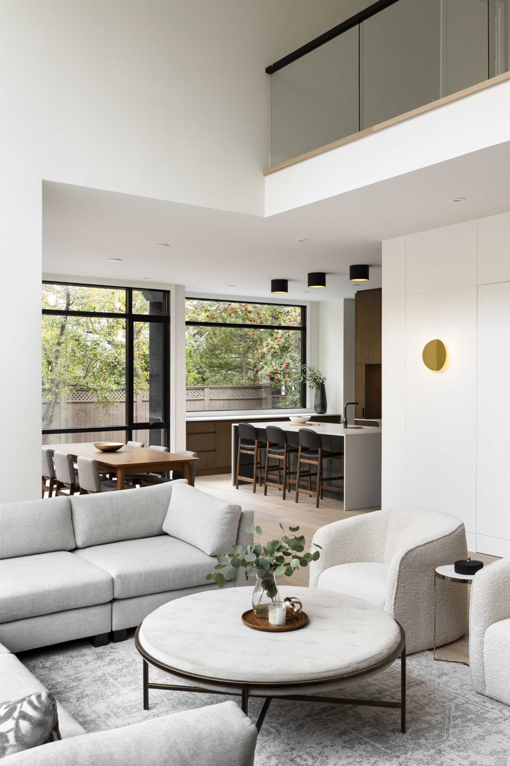 The living room in this modern home connects with the dining area and kitchen.