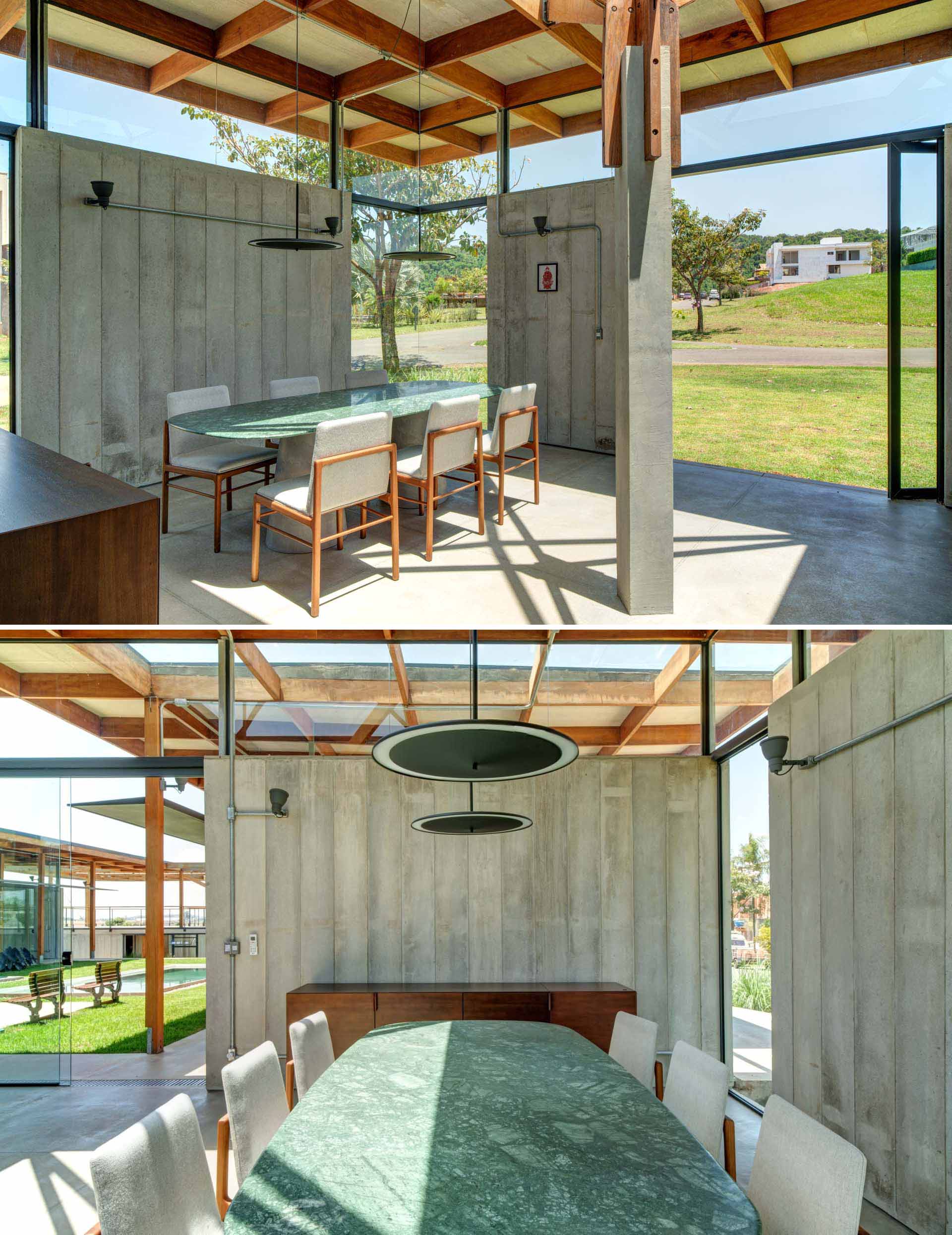 Concrete walls are on full display in this dining room.