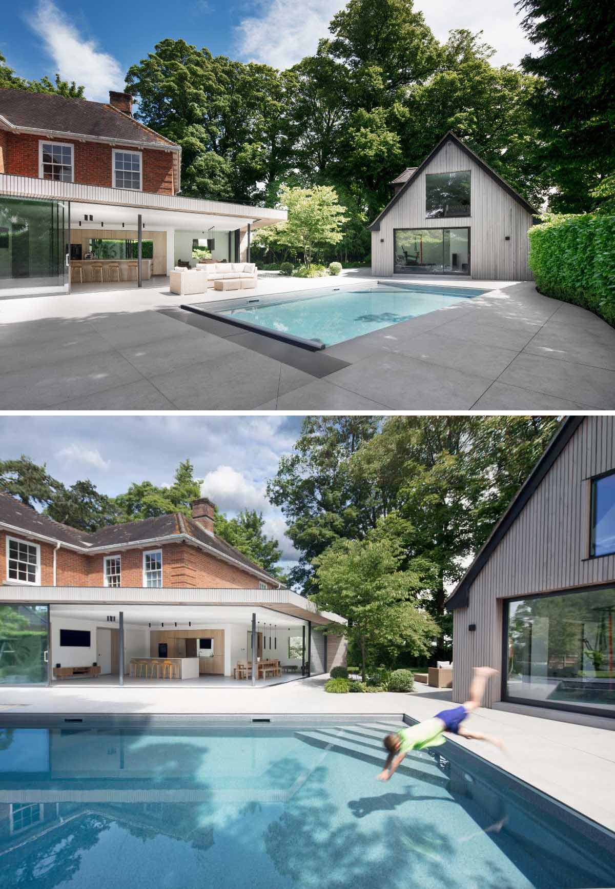 A new contemporary extension with sliding glass walls, makes room for an open plan kitchen and dining area.