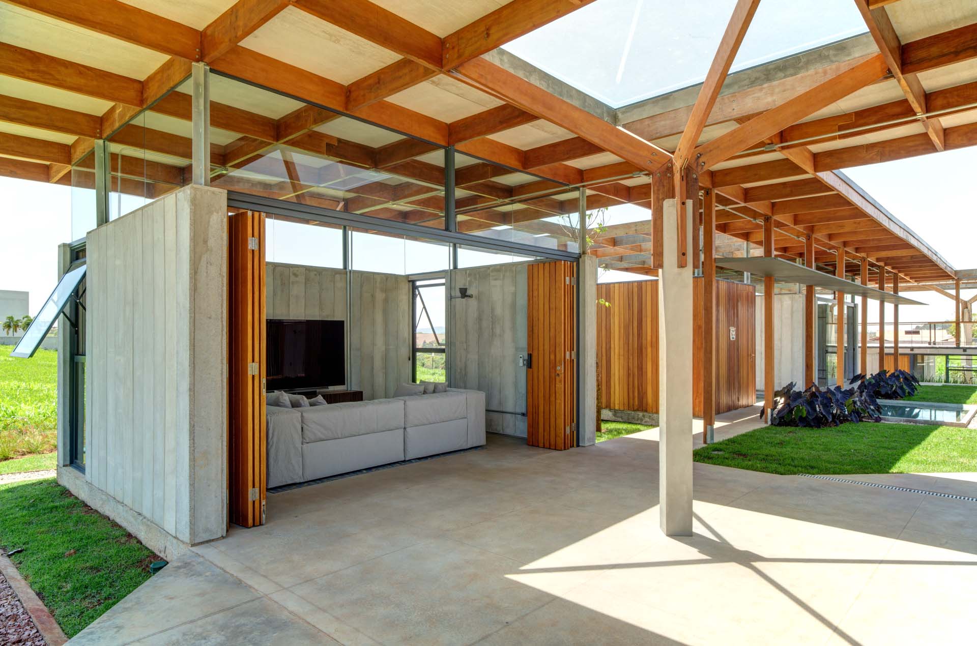 This modern living room opens to the outdoors.