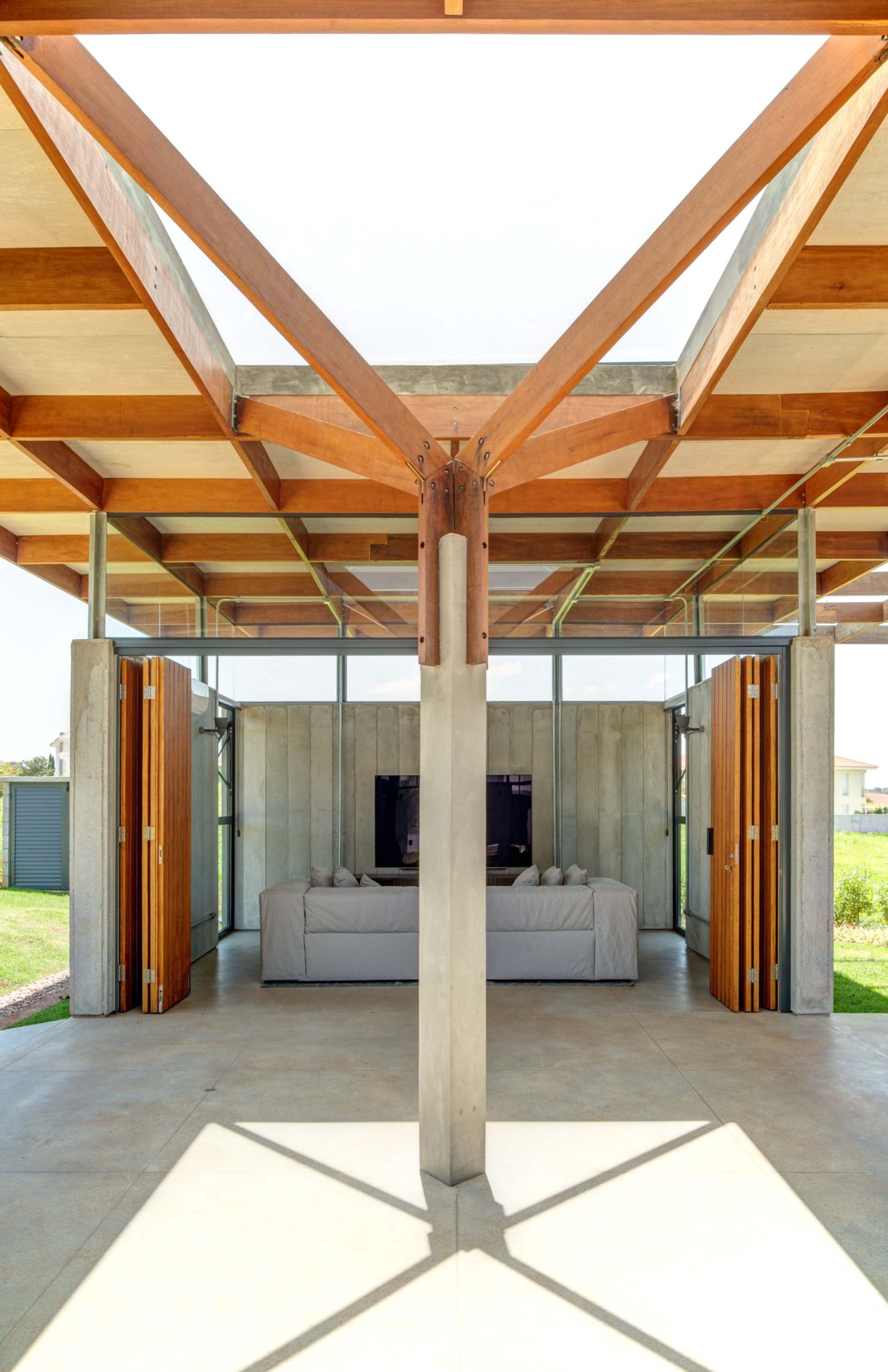 This modern living room opens to the outdoors.