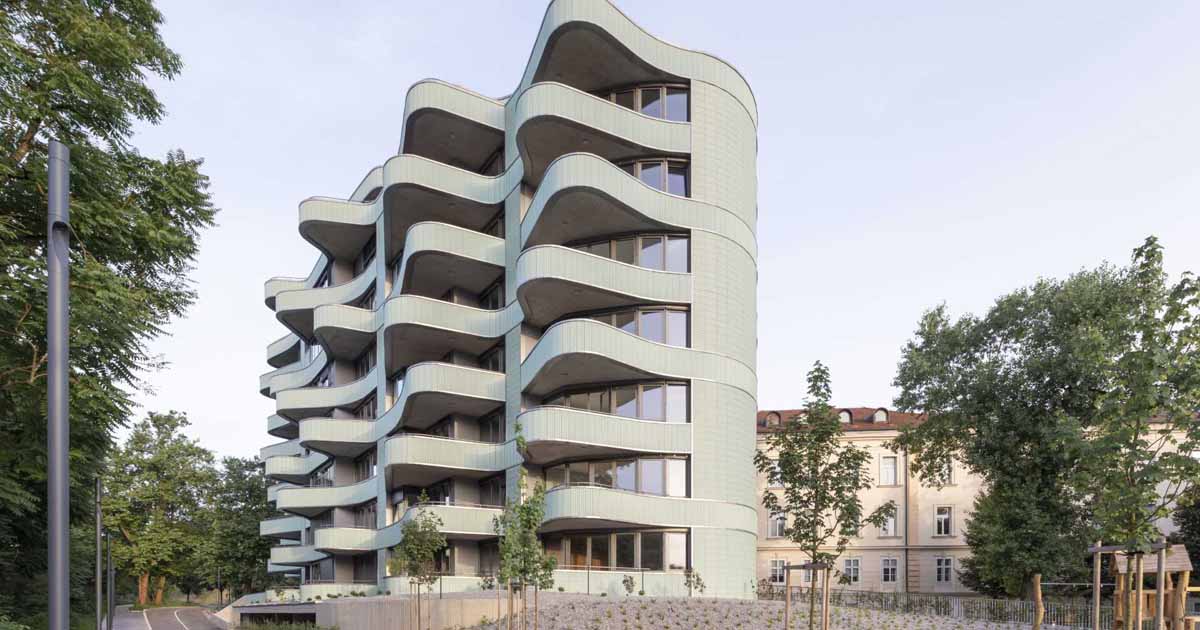 Undulating Balconies And A Mint Green Tiled Exterior Give This New Building A Unique Look