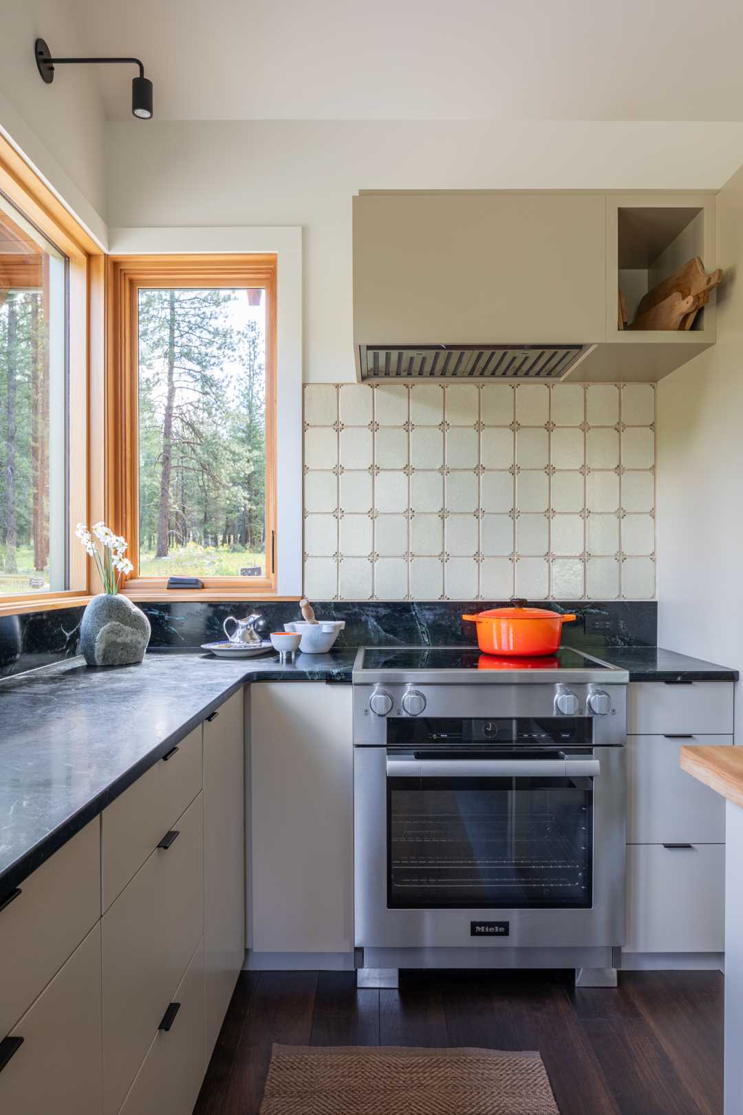 A sizeable kitchen has plenty of counter space, while the windows provide an abundance of natural light.