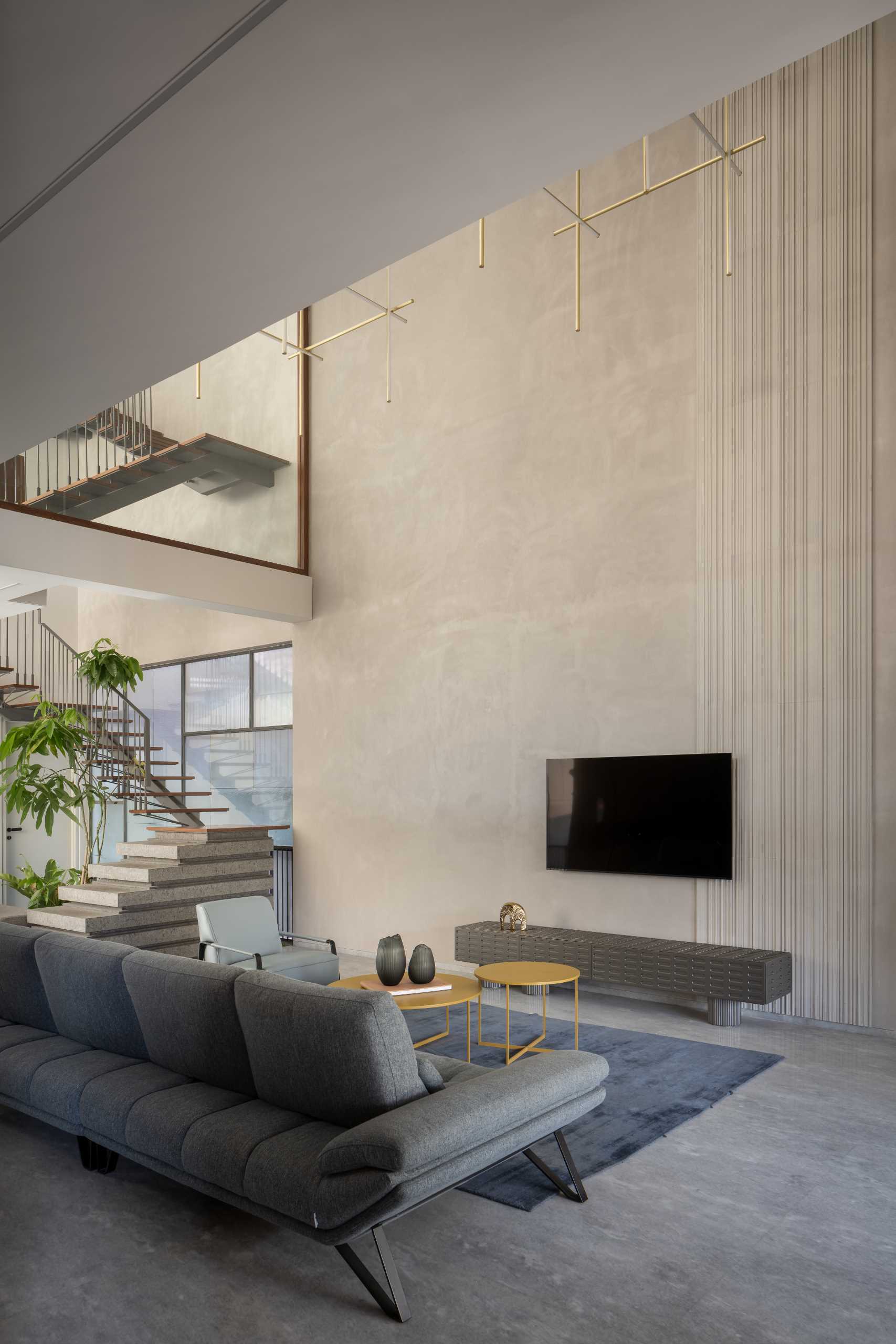 A modern home with a double-height ceiling in the living room.