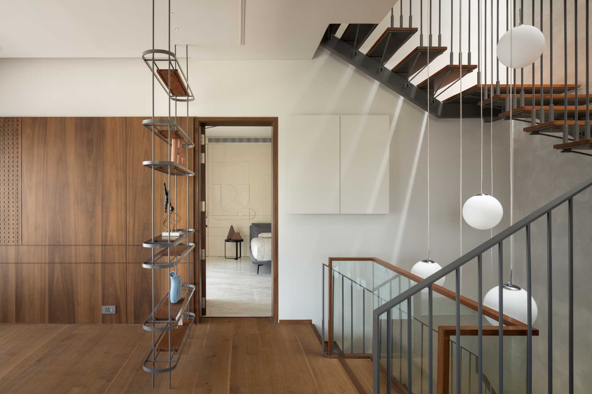 Wood and steel stairs connect the various levels of this modern home.